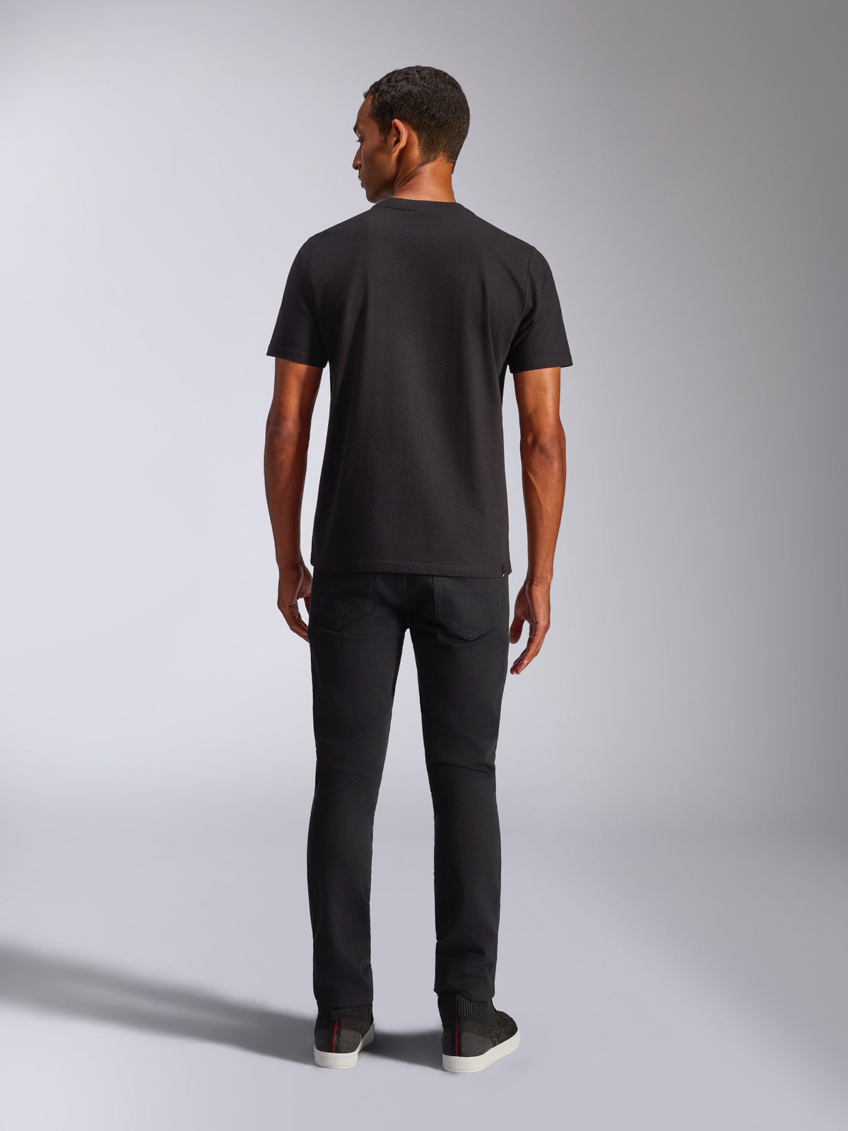 Alpinestars Blaze 2.0 CSF Tee, Short Sleeve T-Shirt, Black, Back View, worn with black jeans, casual motorsport-inspired streetwear