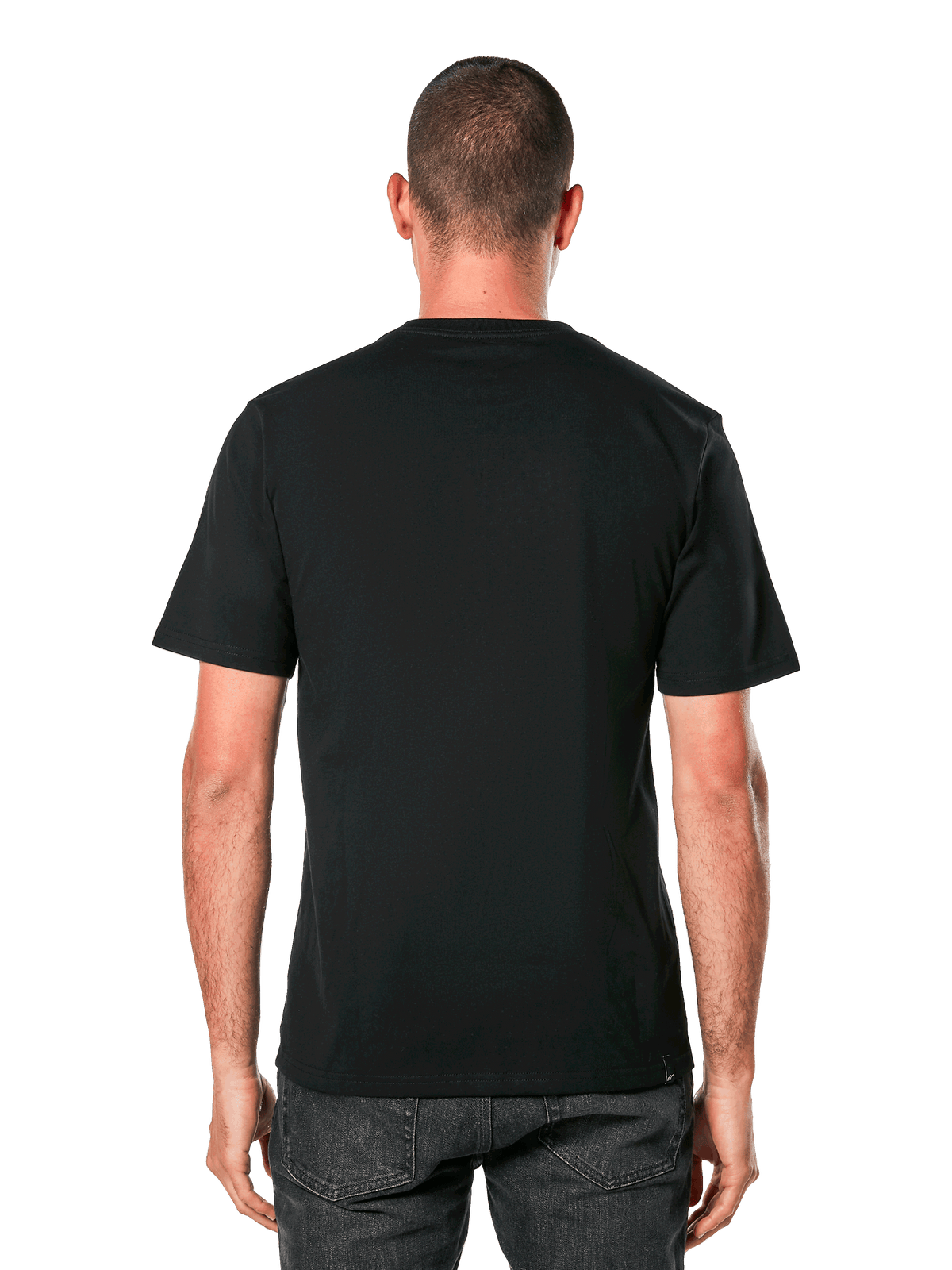 Alpinestars Ride 4.0 CSF Tee, widok z tyłu, czarny T-shirt z krótkim rękawem, casualowa odzież sportowa inspirowana motorsportem, noszona przez mężczyznę w ciemnych jeansach
