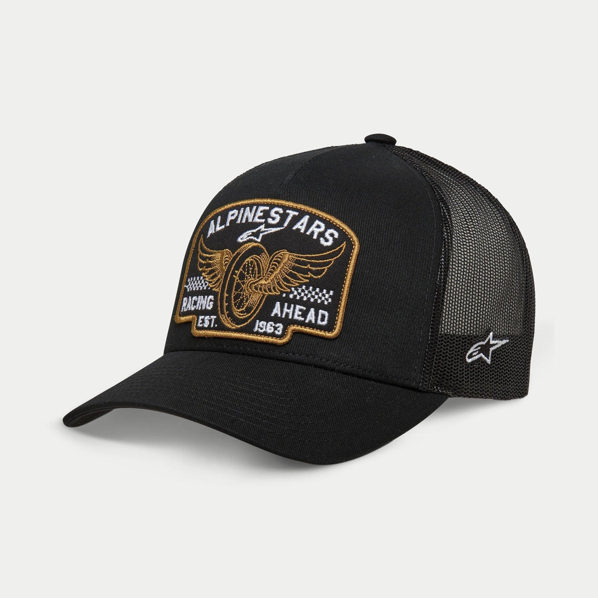 Alpinestars Heritage Patch Trucker Hat, Black, structured crown with curved bill, large front embroidered heritage patch with winged wheel and 'Racing Ahead Est. 1963', black mesh back panels with side star logo, casual motorsport lifestyle headwear