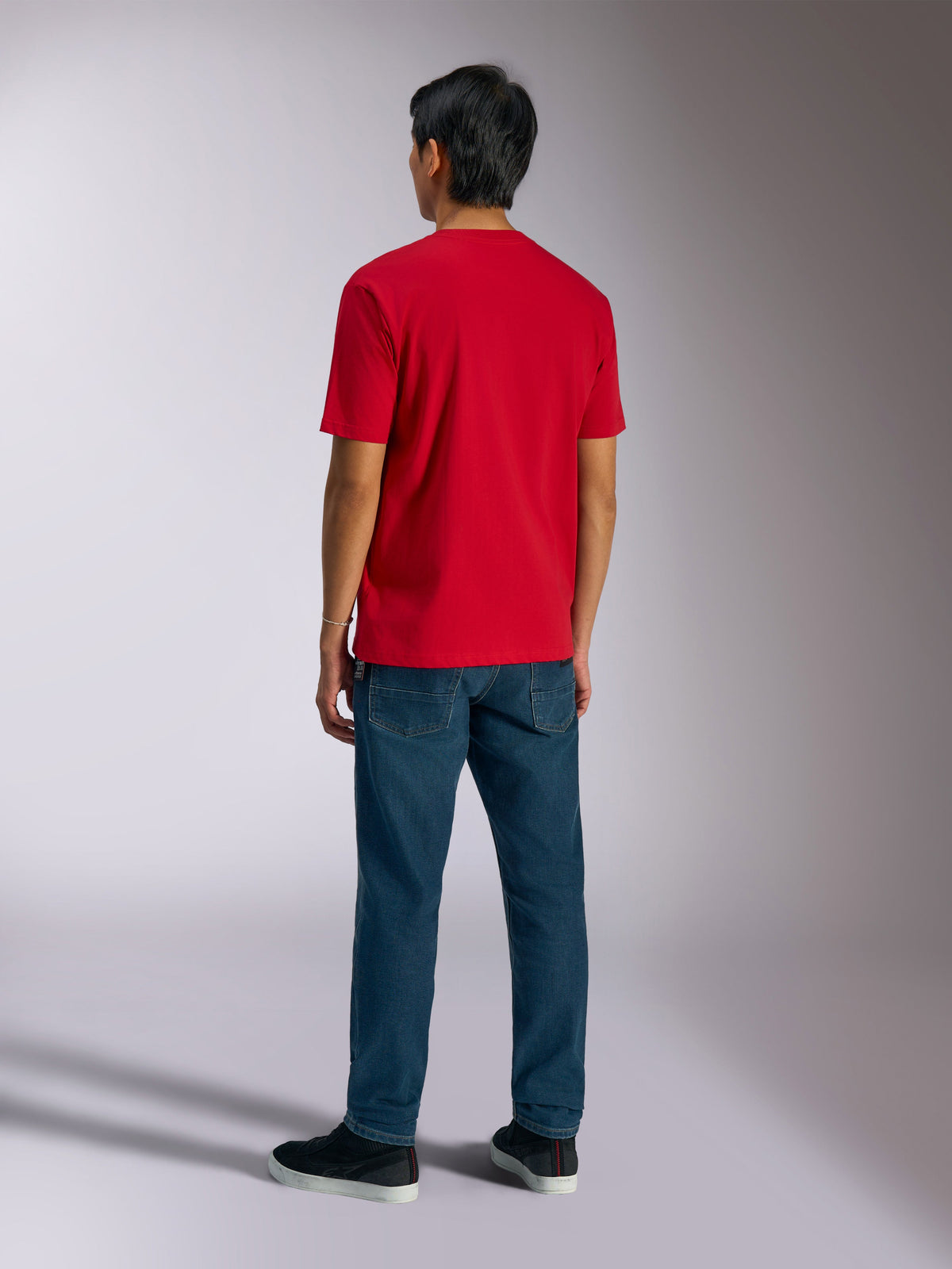 Alpinestars Ageless Shadow CSF Tee, Short Sleeve T-Shirt, Red, back view worn by model with blue jeans and black sneakers, casual motorsport streetwear