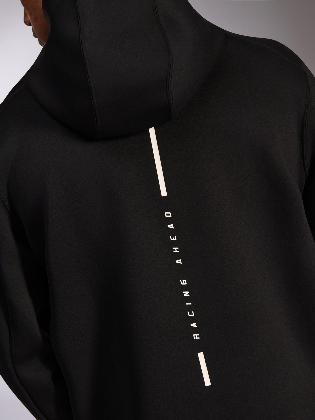 Alpinestars Insight Hoodie, casual sportswear hoodie, black, back view with vertical white Racing Ahead stripe logo, smooth tri-blend double face fleece, modern motorsport-inspired design