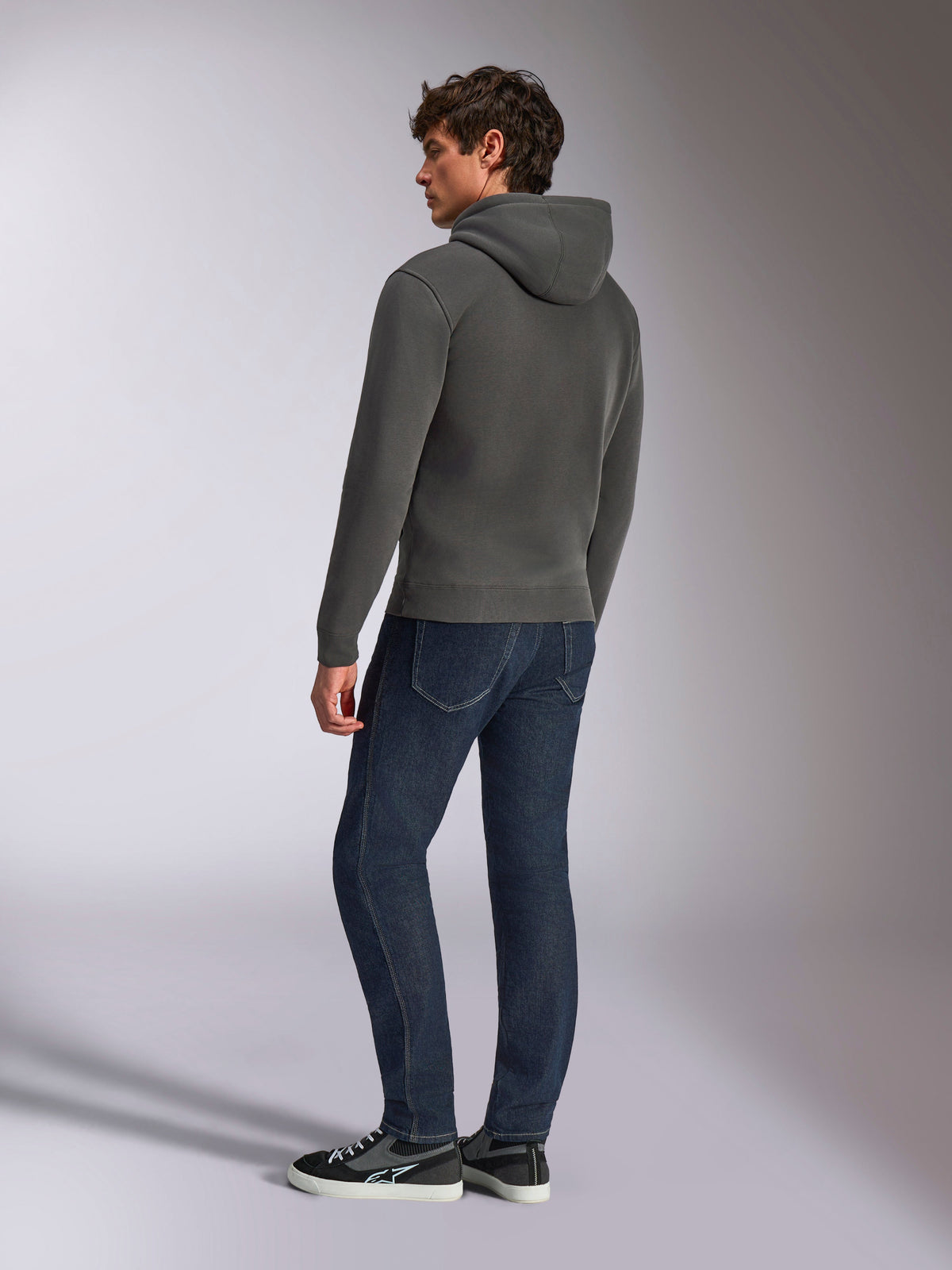 Alpinestars Ellipsoid Hoodie, casual sportswear, gunmetal gray, back view on male model, drawstring hood, long sleeves, ribbed cuffs and hem, paired with dark jeans and sneakers