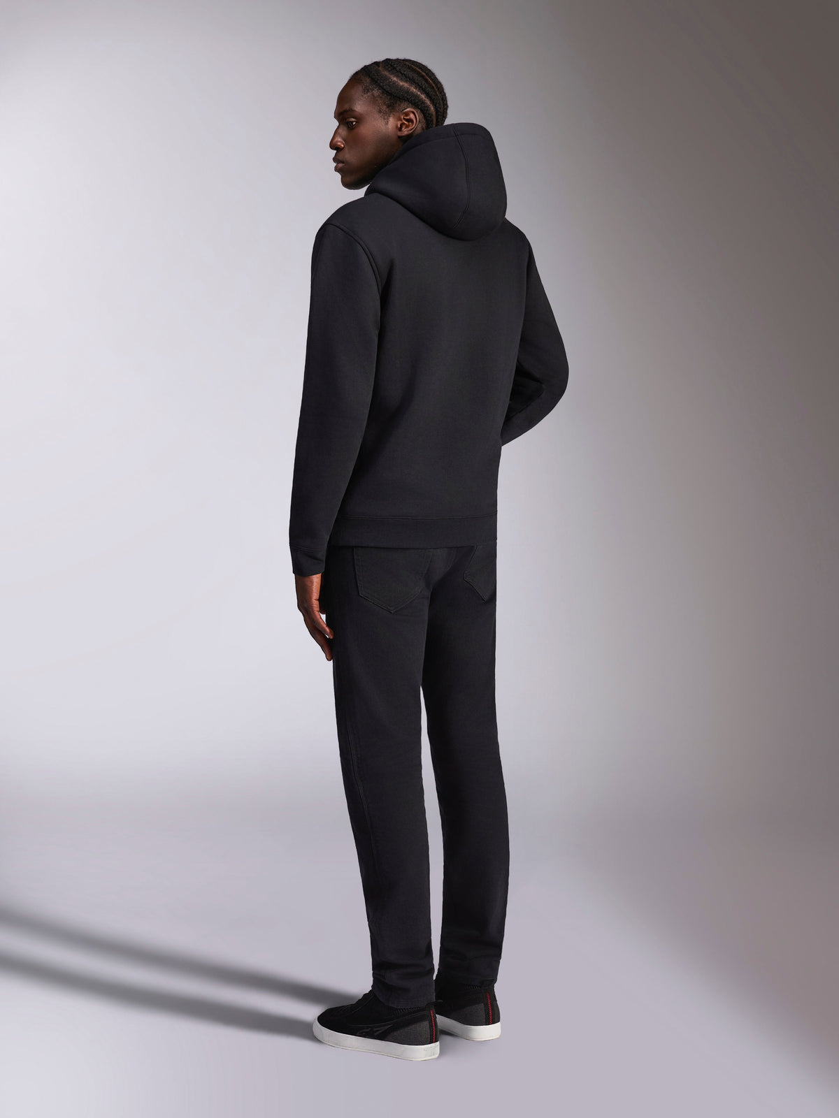 Alpinestars Pulse Hoodie, casual streetwear, Black, back view of model wearing solid black hooded pullover fleece, minimalist design with rib-knit cuffs and hem