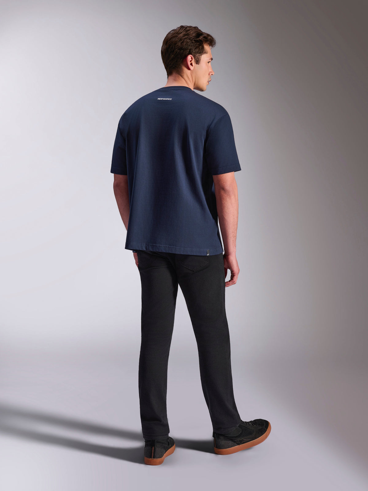 Alpinestars Focused Oversized CSF Tee, Short Sleeve T-Shirt, Navy Blue, back view showing small white Alpinestars word logo on the neck, worn with black pants, casual lifestyle apparel