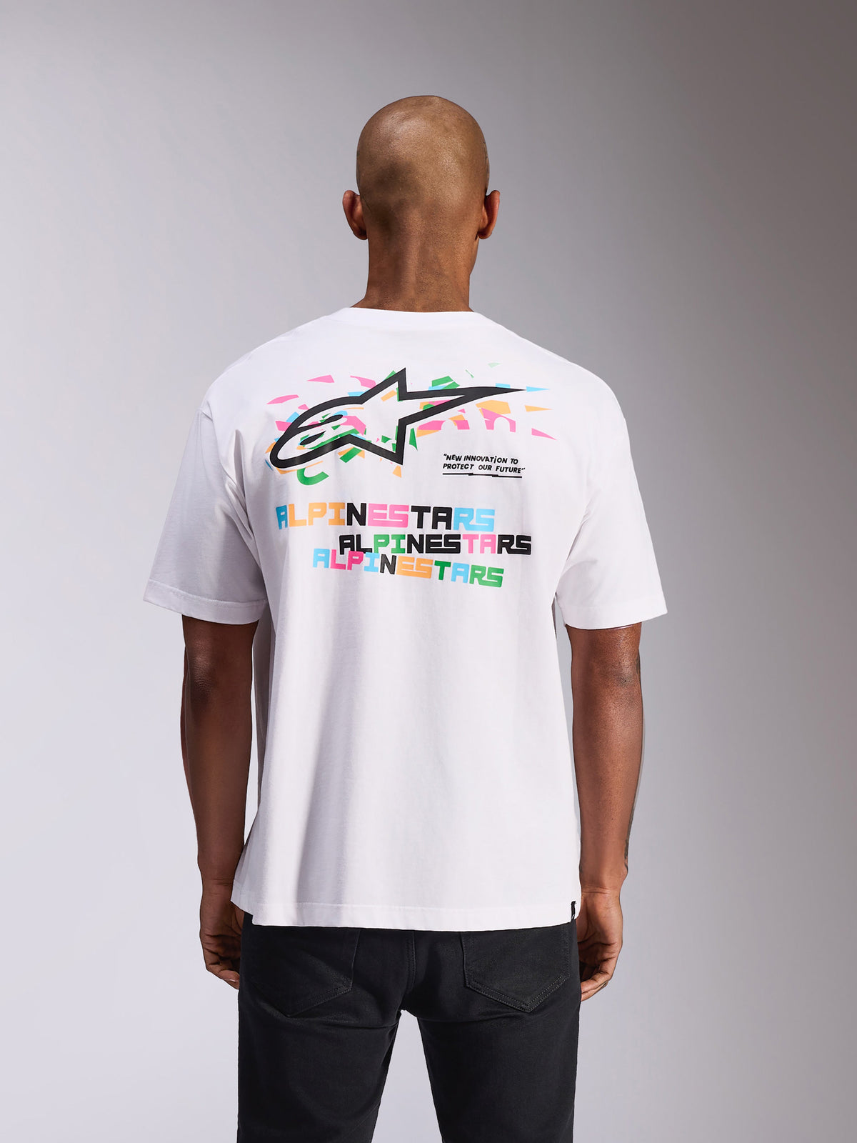 Alpinestars Wild Oversized CSF Tee, Short Sleeve T-Shirt, White, back view featuring vibrant multicolor Astars logo and text prints, oversized fit, casual motorsport streetwear