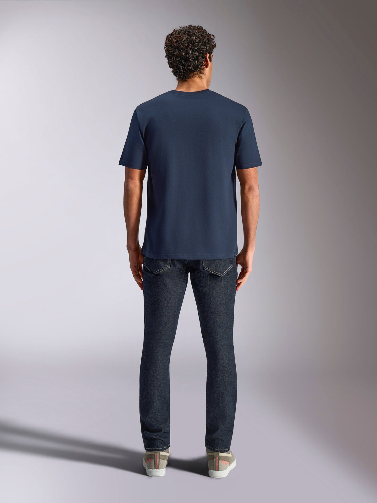 Alpinestars Trifecta CSF Tee, Short Sleeve T-Shirt, Navy Blue, back view on model, paired with dark denim jeans and casual sneakers, casual motorsport streetwear