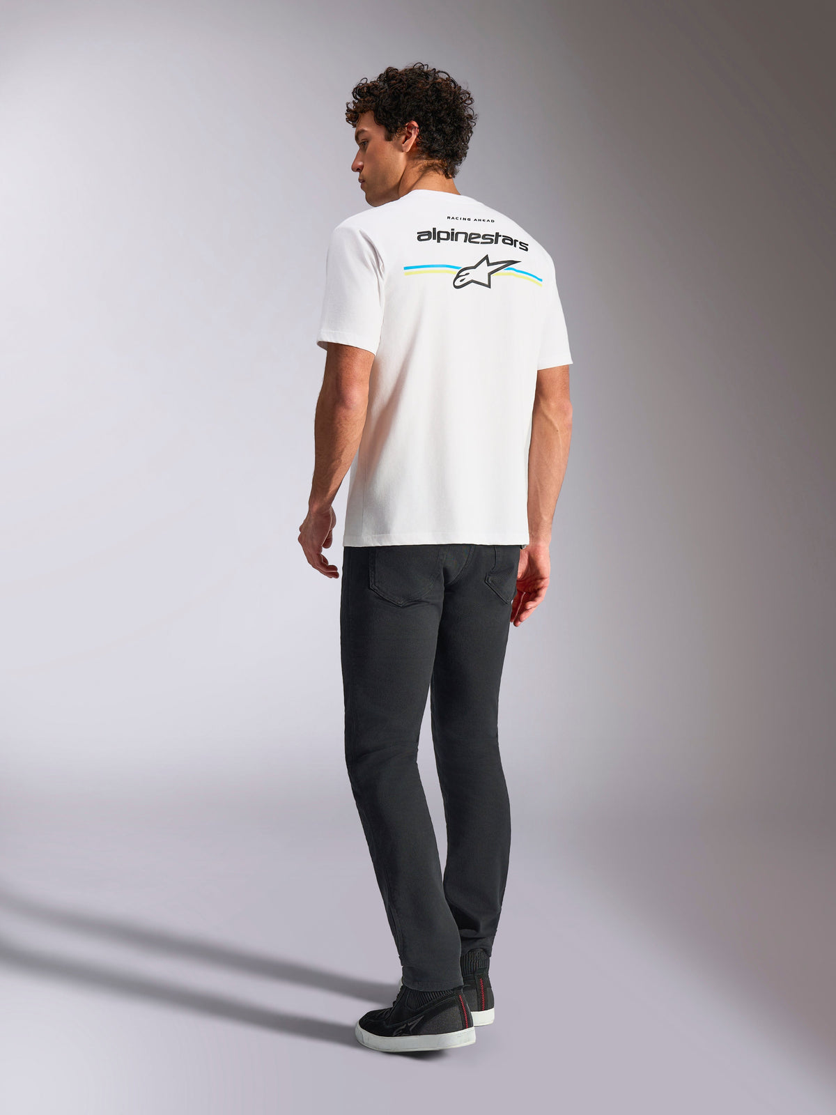 Alpinestars Lanes CSF Tee, Short Sleeve T-Shirt, White, back view showing Alpinestars logo with yellow and blue stripes, casual motorsport streetwear