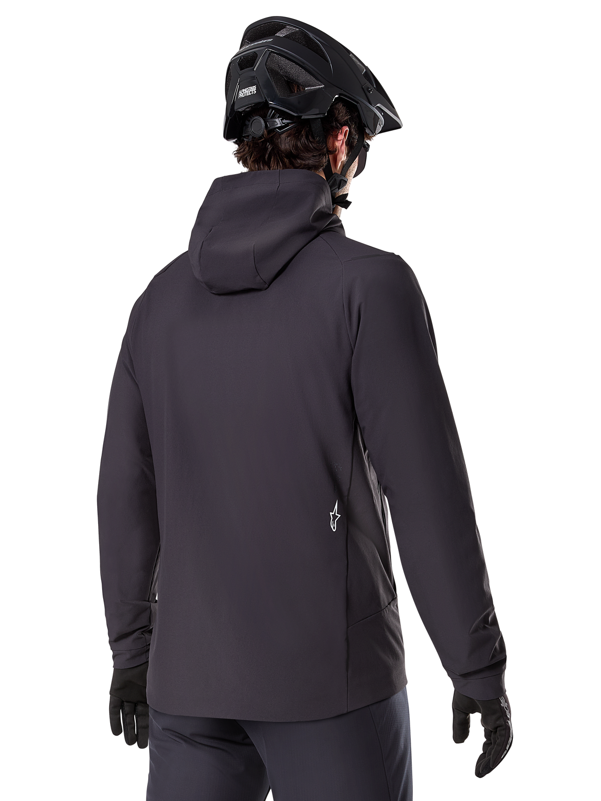 Alpinestars A-Dura Thermal Jacket, Black, back view, worn with a black mountain bike helmet and gloves, features a small white Astars logo on the lower back, lightweight insulated cycling jacket