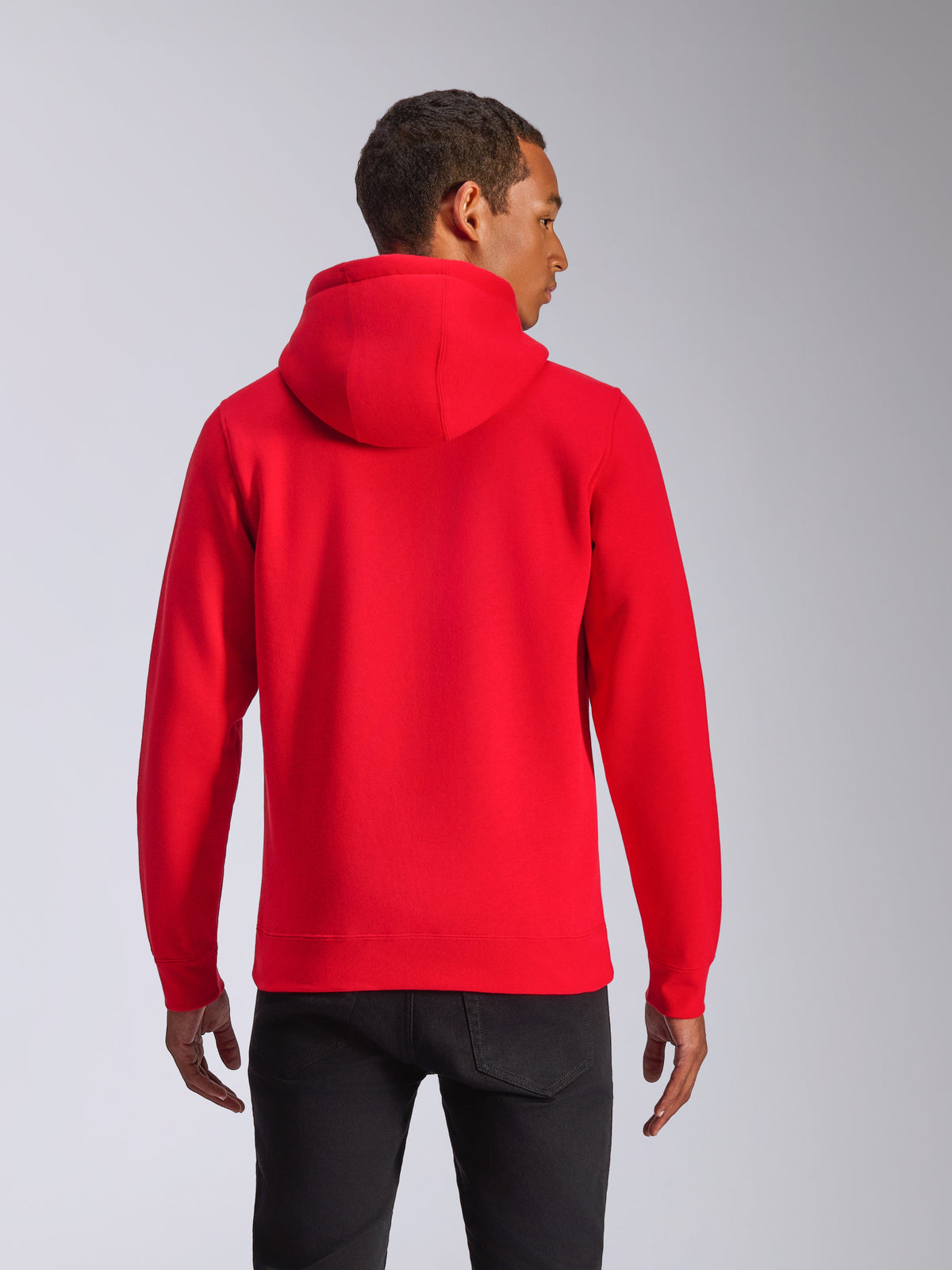 Alpinestars Ageless V3 Hoodie, back view, red pullover hoodie, casual sportswear featuring a jersey-lined hood and ribbed cuffs, worn by a model with black pants