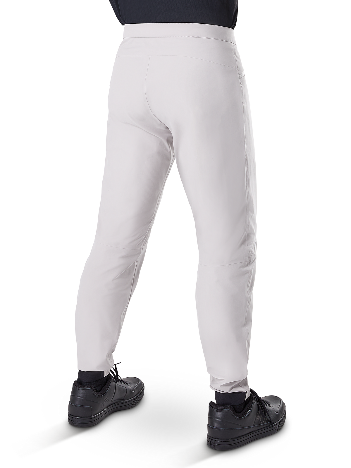 Alpinestars A-Dura Waterproof Pants, MTB Cycling Pants, Titanium Gray, rear view showing tapered legs and elasticated cuffs, worn with black shoes, waterproof technical gear for mountain biking
