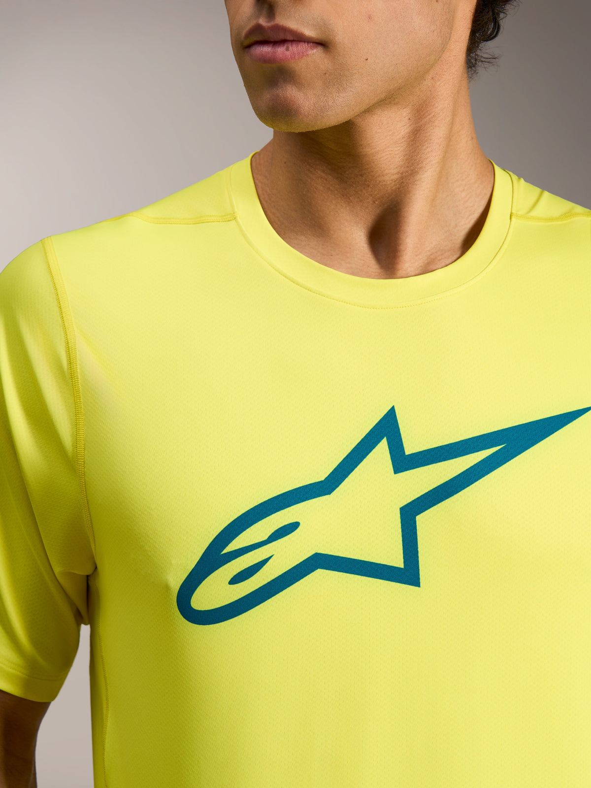 Koszulka A-Dura Ride Yellow Fluo z krótkim rękawem, morskie logo Astars na piersi, lekka odzież techniczna MTB.