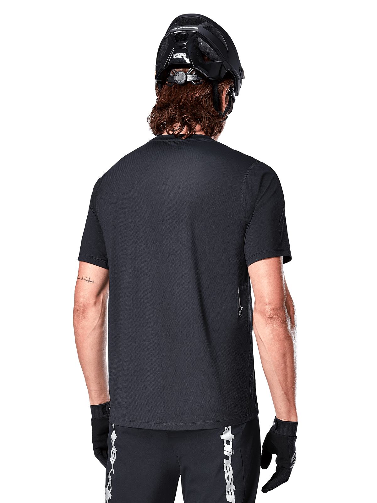 Alpinestars A-Dura Switch Jersey, Black men's short sleeve MTB jersey, rear view highlighting the drop tail and regular fit.