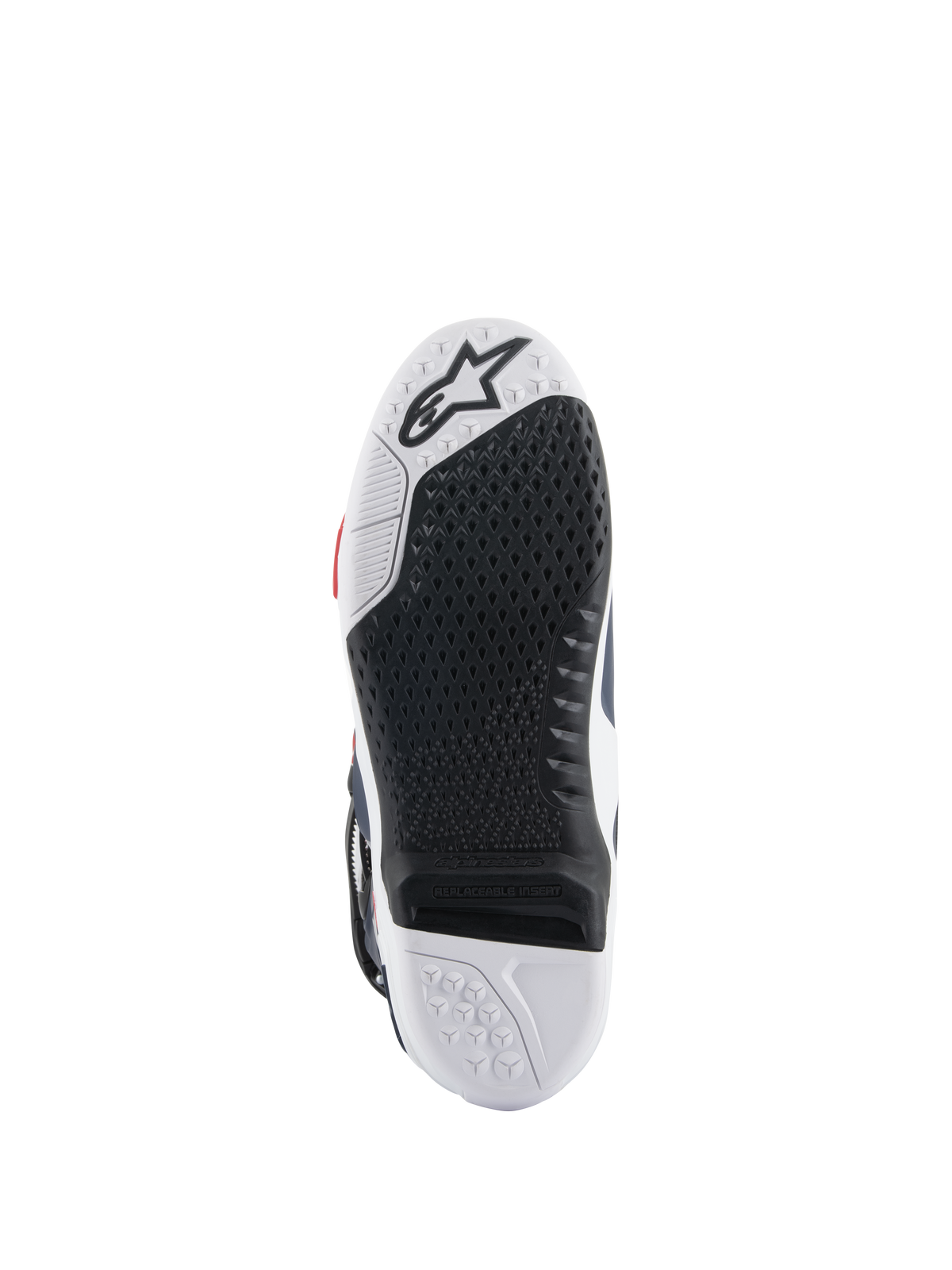 Alpinestars Tech 10 Supervented Boots sole, bottom view featuring a black and white dual-compound design, honeycomb grip texture, replaceable central insert, and embossed Alpinestars logo, optimized for motocross foot-peg performance.