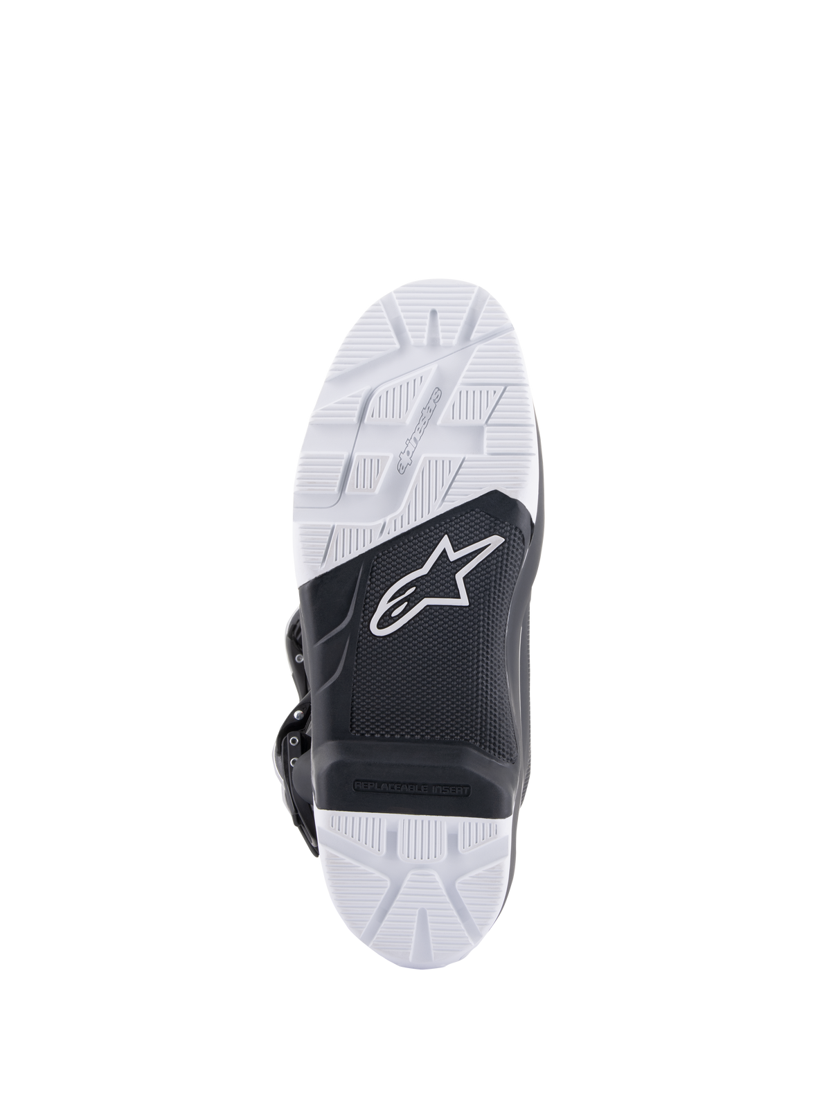 Buty Alpinestars Tech 7 Enduro, widok podeszwy prezentujący specjalnie zaprojektowaną podeszwę zewnętrzną z mieszanki, czarno-biały dwukolorowy design z teksturowanymi wzorami przyczepności, białe logo gwiazdy i wymienna wkładka na podnóżek