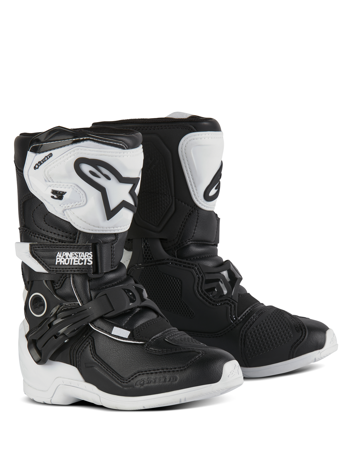 Buty Alpinestars Kids Tech 3S, buty motocrossowe, czarno-białe, z białymi ochraniaczami piszczeli TPU i czarnym logo Alpinestars, regulowane klamry i rzepy, wytrzymałe gumowe podeszwy zapewniające ochronę terenową dla dzieci.