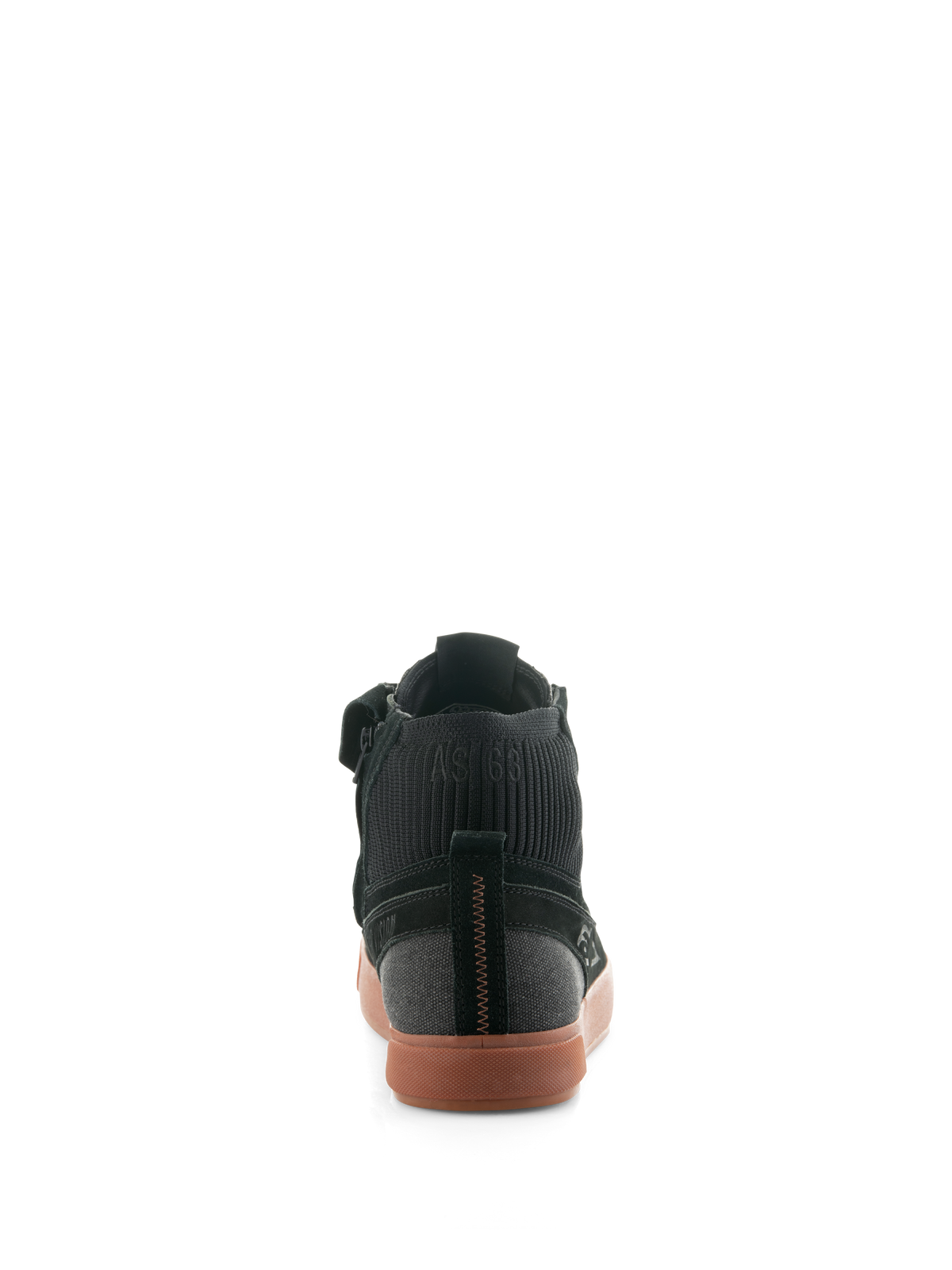 Alpinestars Stated Shoes, miejskie buty motocyklowe Black Gum, widok z tyłu przedstawiający gumową wulkanizowaną podeszwę, czarną cholewkę z zamszu i płótna oraz prążkowany dzianinowy kołnierz kostki