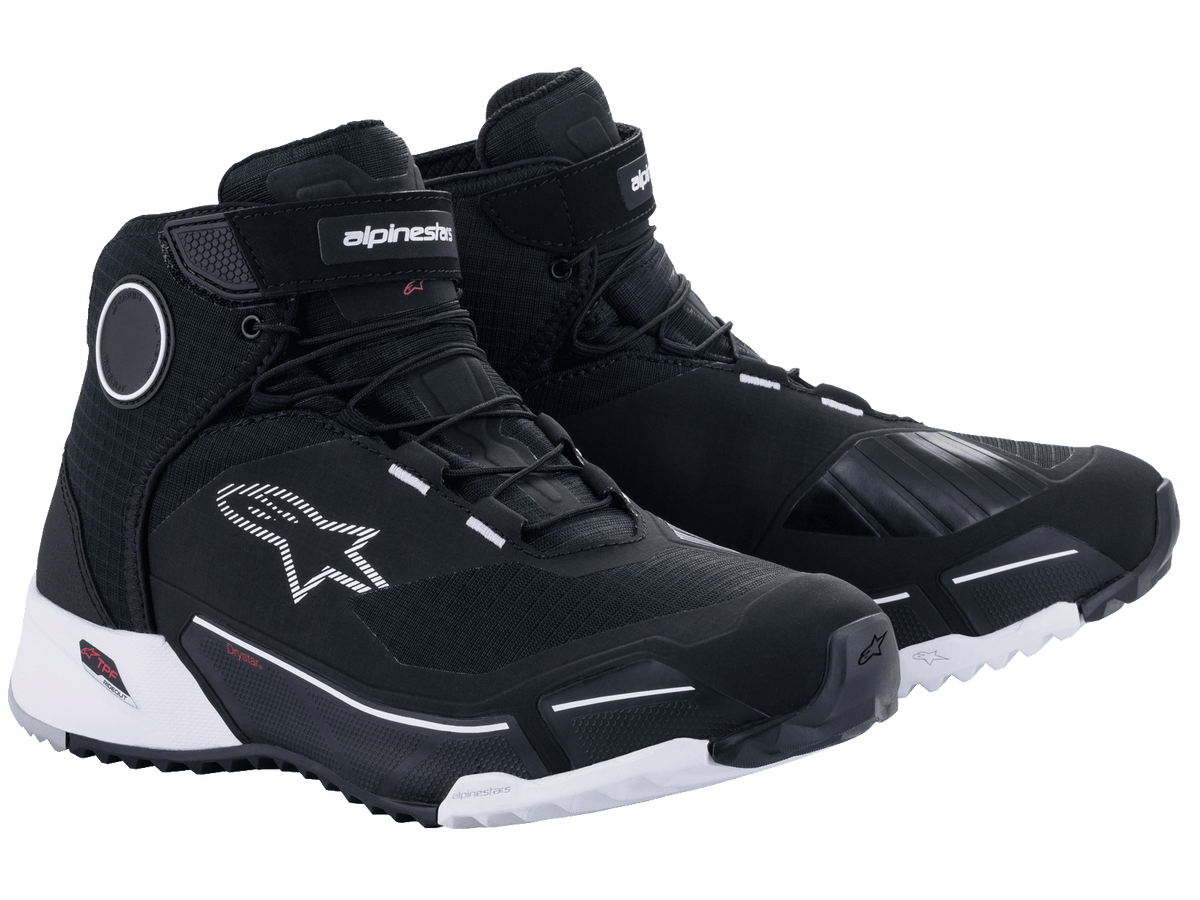 Alpinestars CR-X Drystar Riding Shoes in Black and White, athletic-style waterproof motorcycle shoes featuring a white outsole, black textile upper with white logo accents, and protective ankle discs.