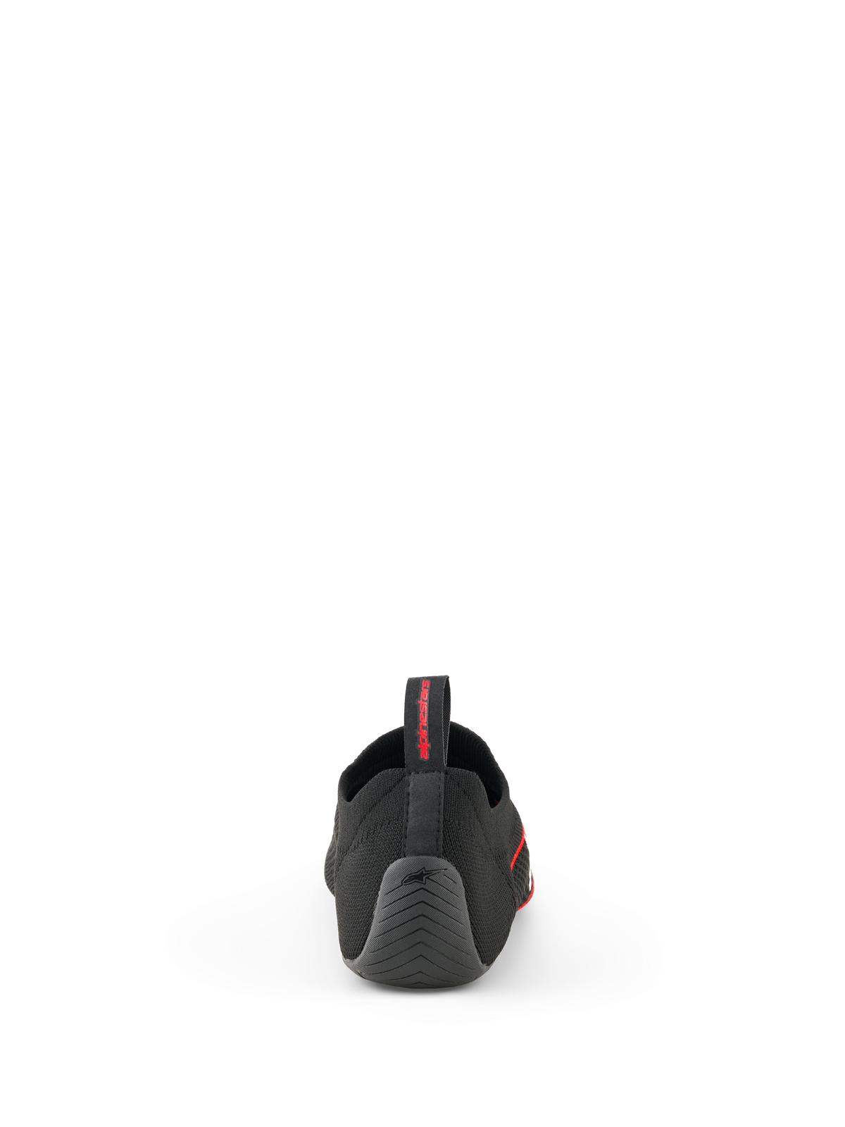 Buty Alpinestars Tech Gaming, czarne, widok od tyłu przedstawiający bezszwową dzianinową cholewkę, teksturowaną gumową piętę z logo gwiazdy i tylny uchwyt z czerwonym brandingiem, obuwie do SIM-racingu