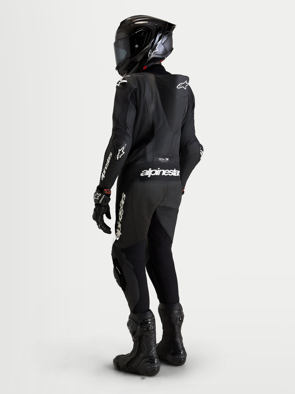 Alpinestars Missile V3 Leather Suit 1-Piece, Men's motorcycle racing suit, Black, rear view showing aerodynamic speed hump, CE AAA certified leather construction and branding details