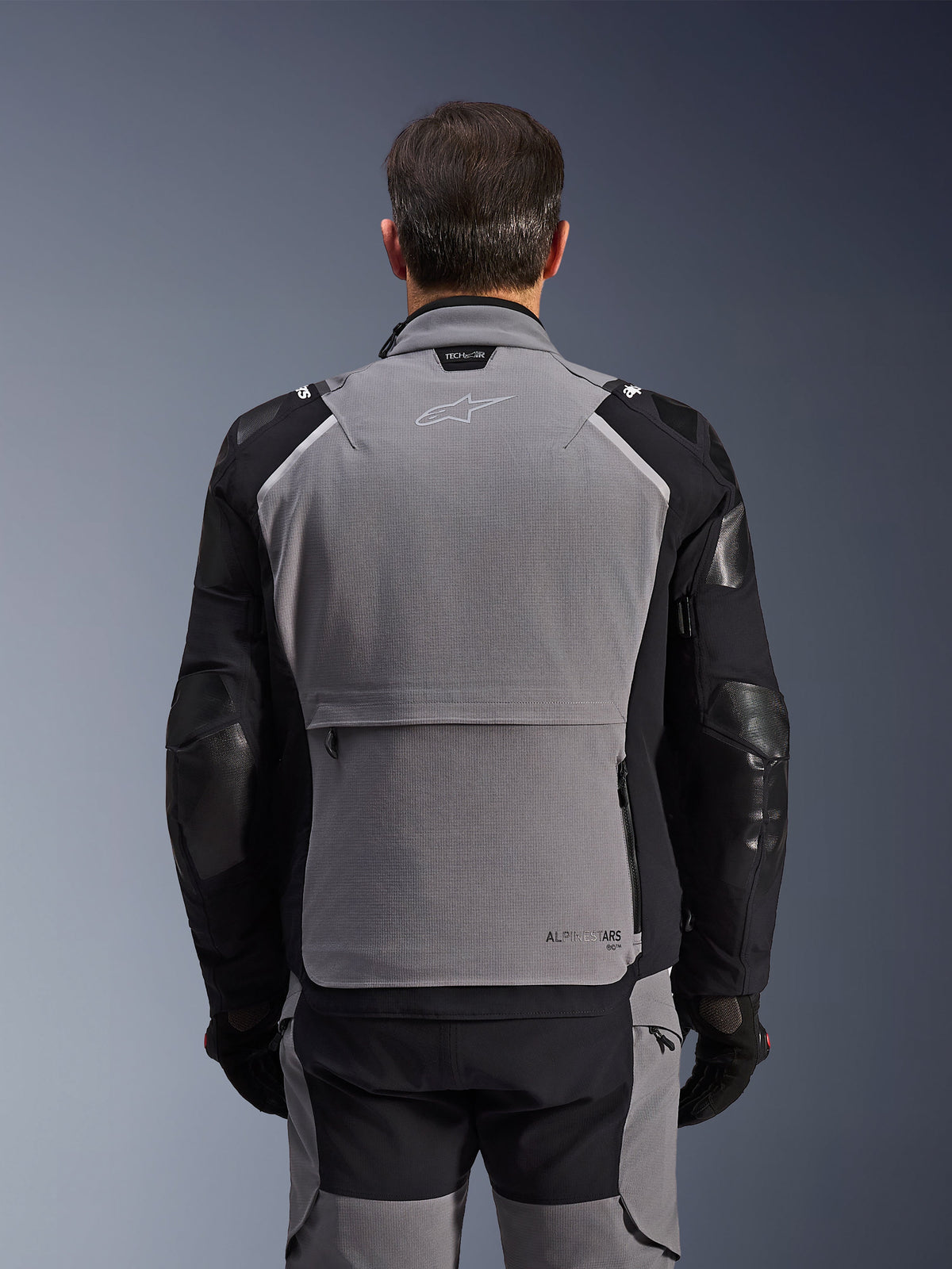 Alpinestars Andes Pro Drystar® XF Jacket, Rear View, Dark Gray and Black, adventure touring jacket featuring a large rear storage pocket, Tech-Air® Ready branding on the collar, and reinforced elbow panels.