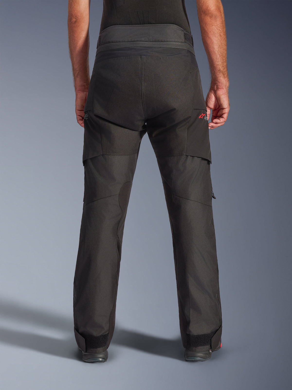 Alpinestars Andes V4 Drystar® Pants, Adventure Motorcycle Pants, Black, back view showing reinforced panels on the seat and lower legs, high-waisted textile construction with adjustable waist and ankle straps
