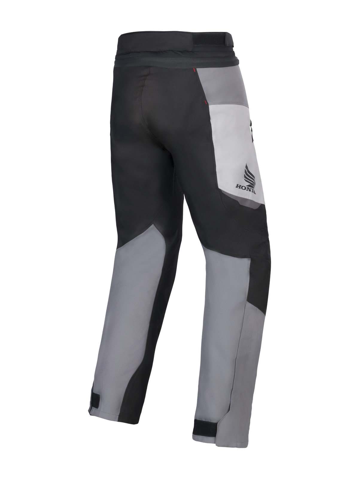 Spodnie Alpinestars Honda St-1 Waterproof, motocyklowe spodnie turystyczne, w kolorach Ice Gray, Dark Gray i czarnym, widok z tyłu ukazujący wielopanelową konstrukcję tekstylną, logo Honda na udzie i regulowane zapięcia na kostkach do jazdy w każdą pogodę.
