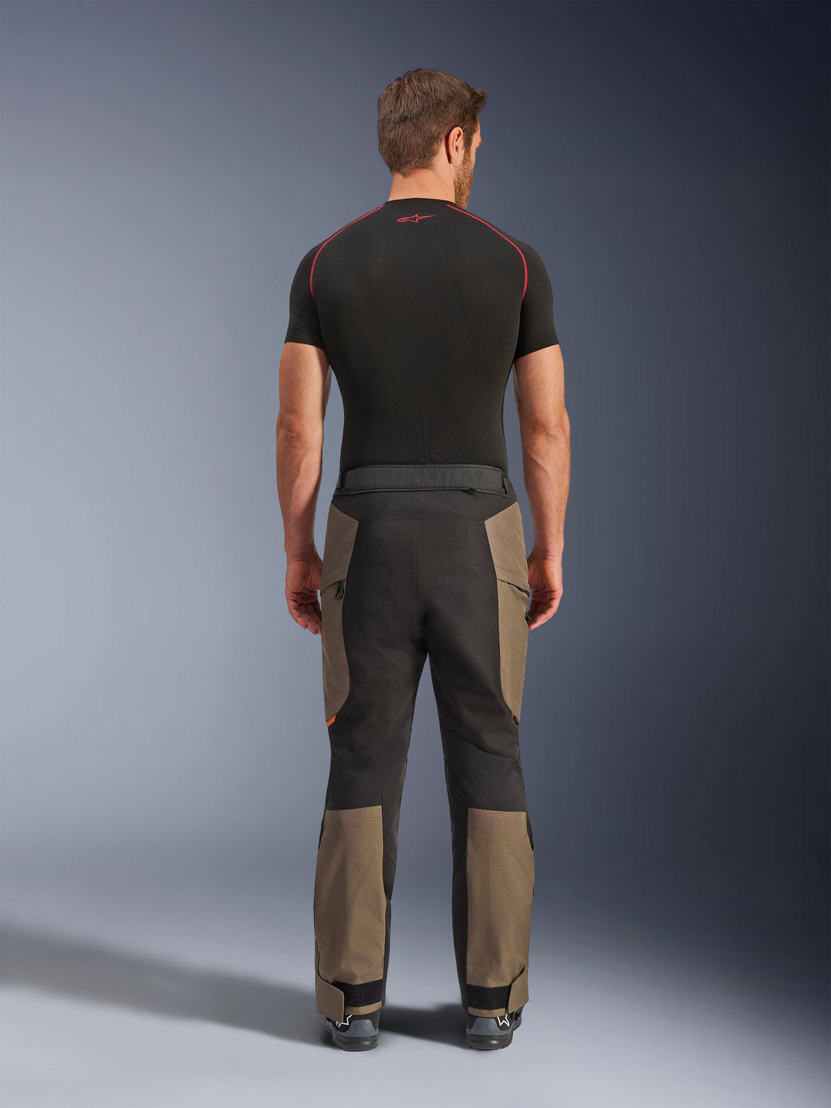 Alpinestars Cusco Drystar® Pants, Adventure Motorcycle Pants, Walnut Black, back view showing brown and black paneling, durable ripstop construction, worn with a black base layer shirt