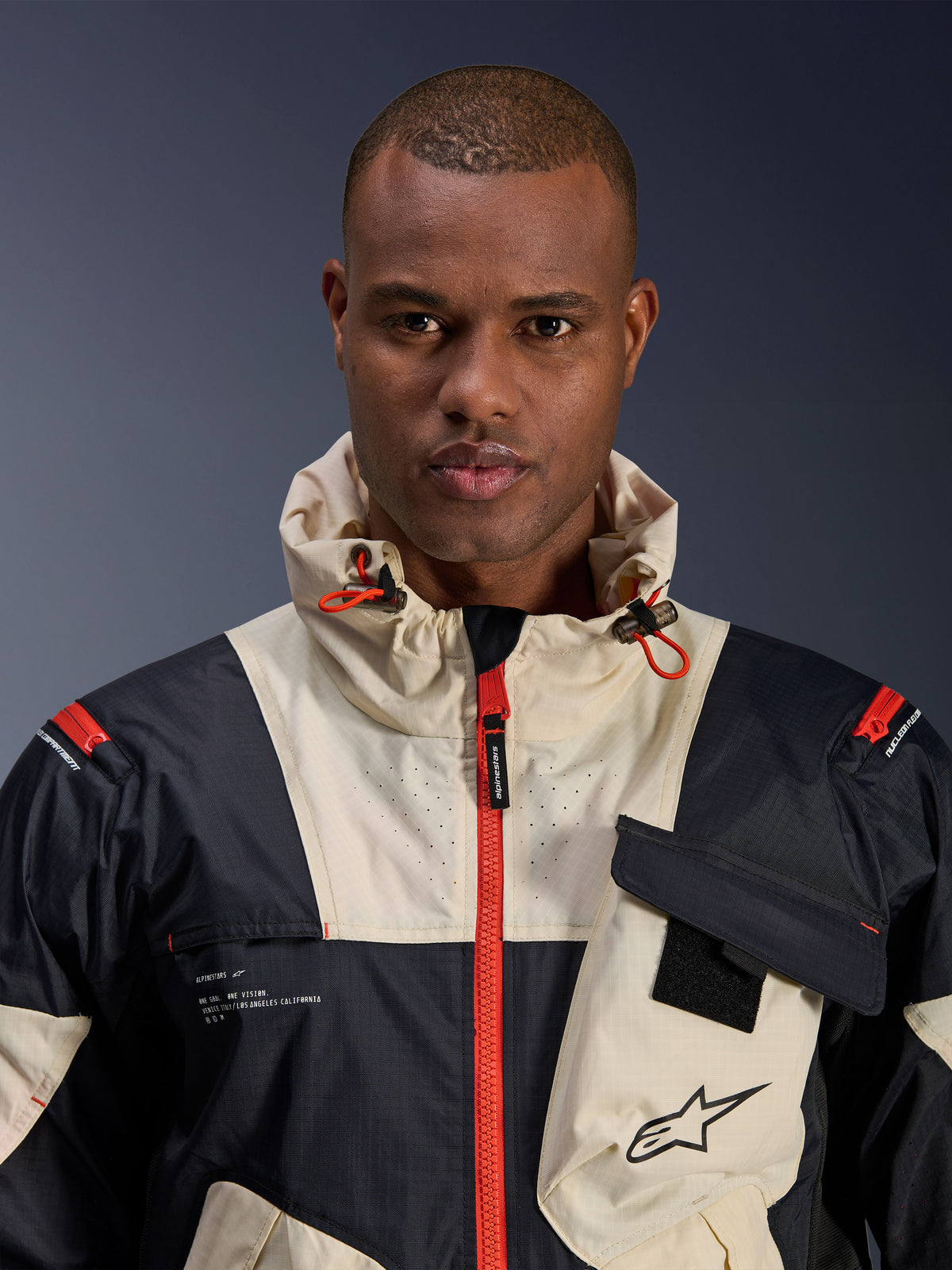 Alpinestars Mogress Air, męska miejska kurtka motocyklowa, czarna i kremowa z pomarańczowymi detalami, ripstop, z kapturem.