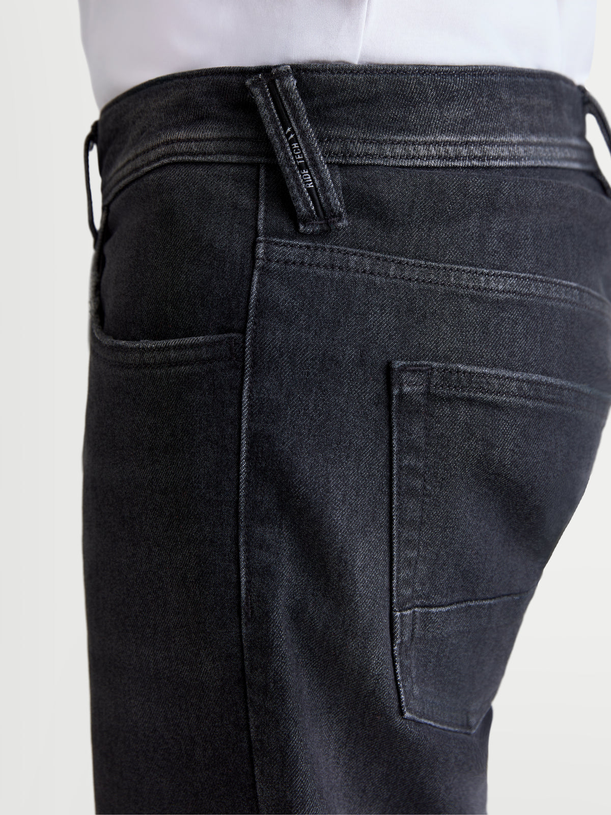 Alpinestars Flex-AST 8 Denim Pants, men's urban motorcycle riding jeans in Used Black, close-up side view showing pocket and branded belt loop detail on a model