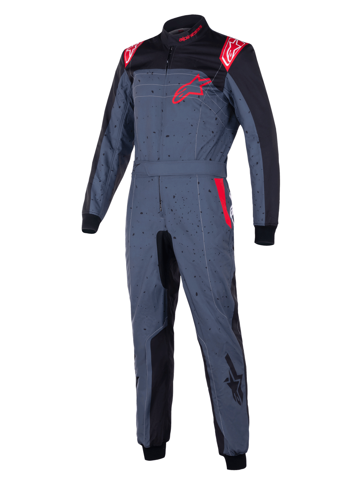Kombinezon Alpinestars KMX-9 V3 Graphic 6, kombinezon kartingowy, szary antracytowy z czarnymi i czerwonymi akcentami, nakrapiany wzór graficzny, czerwone logo gwiazdy na piersi, czarne panele wewnętrzne i czerwone detale na ramionach, profesjonalna odzież wyścigowa do sportów motorowych
