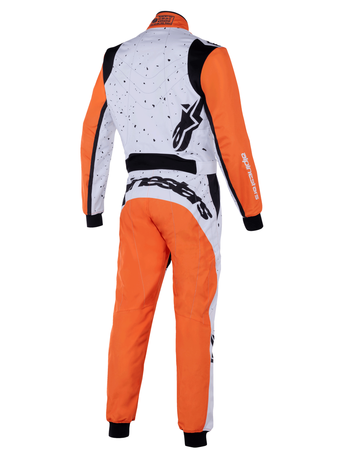 Alpinestars KMX-9 V3 Graphic 6 Suit, kombinezon kartingowy, biało-pomarańczowo-czarny, widok z tyłu przedstawiający nakrapianą grafikę na białej górnej części, pomarańczowe rękawy i nogawki, czarne elastyczne panele oraz wyraźne logo Alpinestars