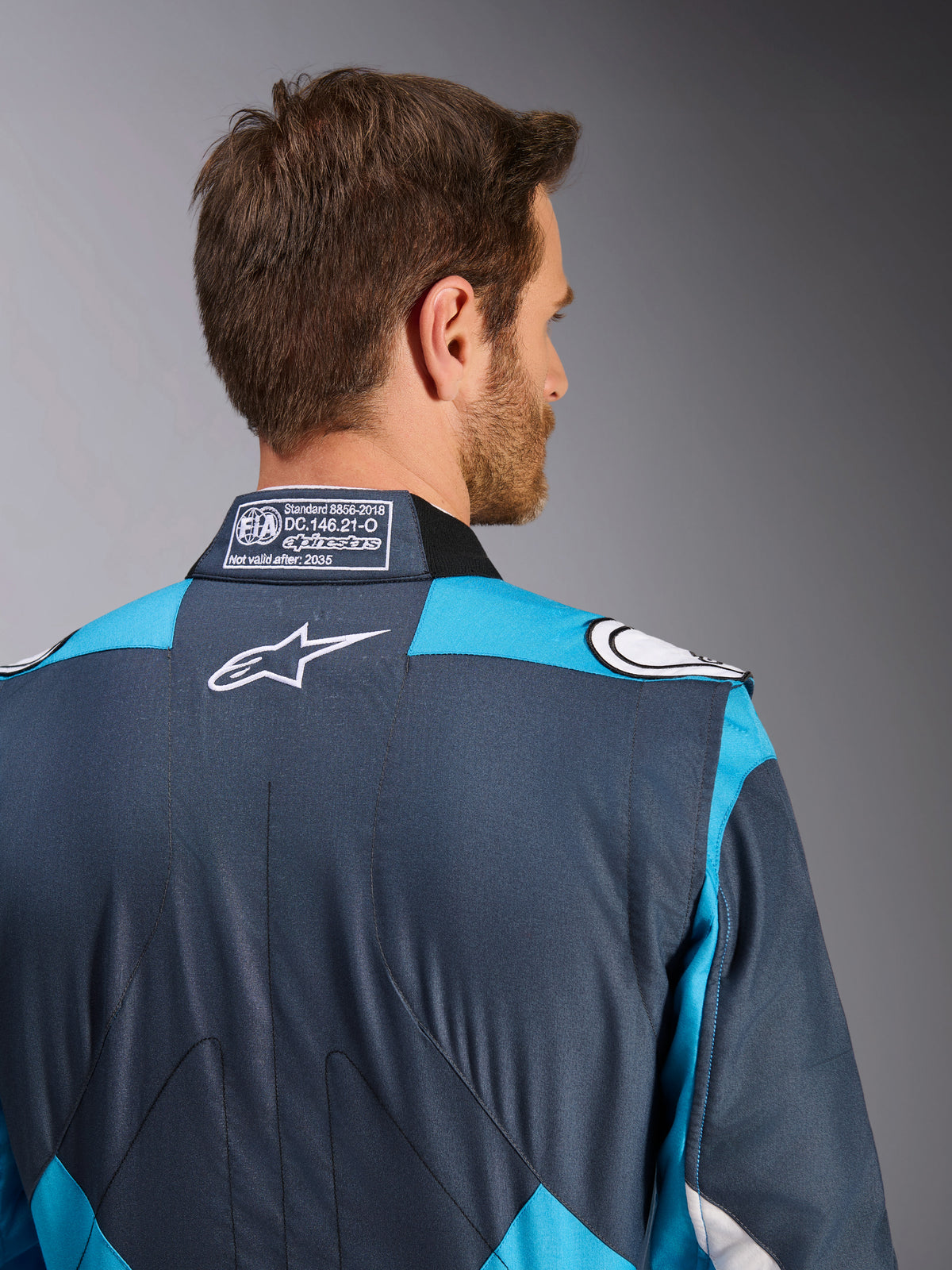 Alpinestars GP Pro Comp V2 FIA Men's Auto Racing Suit, Asphalt and Cyan, with white logo and FIA collar label.