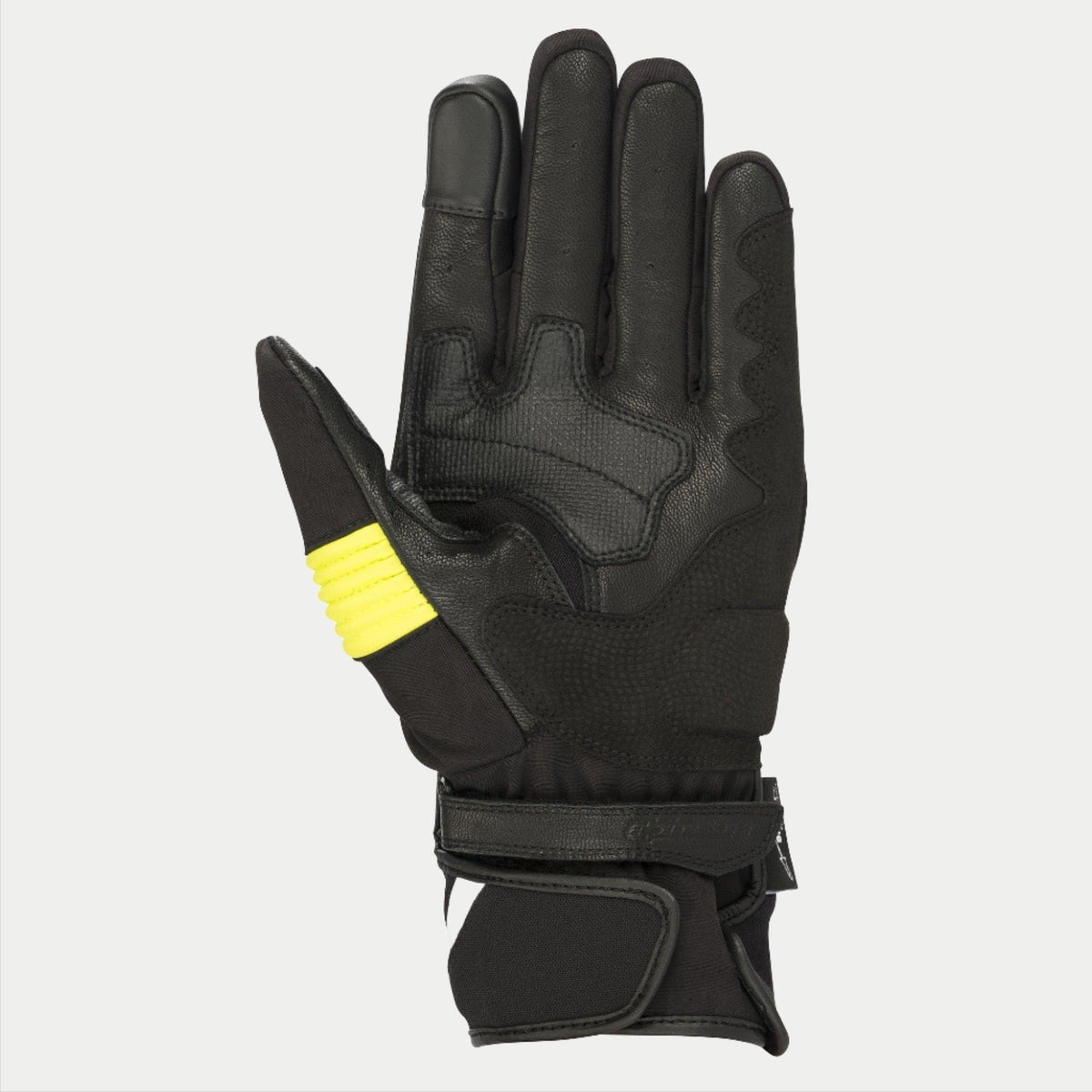 Rękawice Alpinestars T-SP W Drystar®, czarne i żółte fluo, widok od strony dłoni prezentujący konstrukcję ze skóry koziej z fluorescencyjnymi akcentami na kciuku, końcówki palców kompatybilne z ekranami dotykowymi, podwójne zapięcie na rzep na nadgarstku.