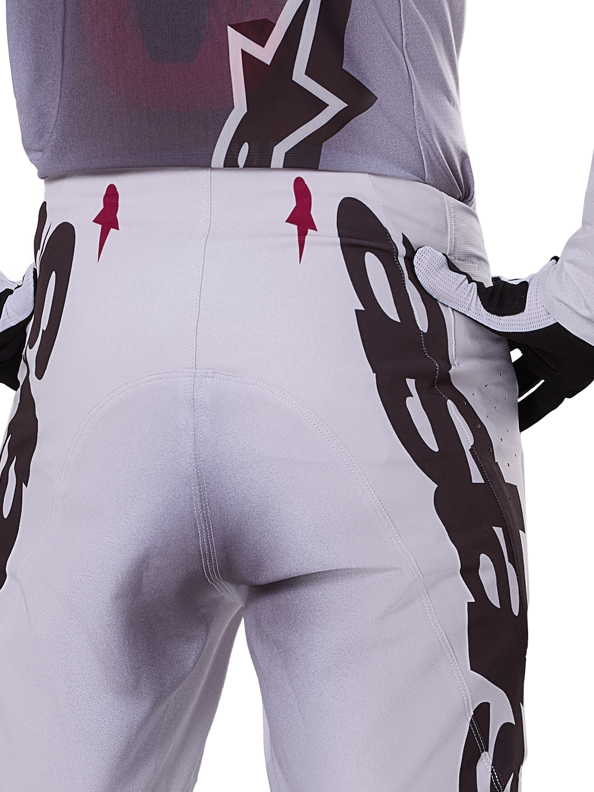 Alpinestars 2025 Supertech Maker Pants, spodnie motocrossowe, srebrne i czarne, sportowy krój z panelami na kolanach ze skóry koziej i strefami Stretchnet, wytrzymała i lekka konstrukcja do profesjonalnego motocrossu