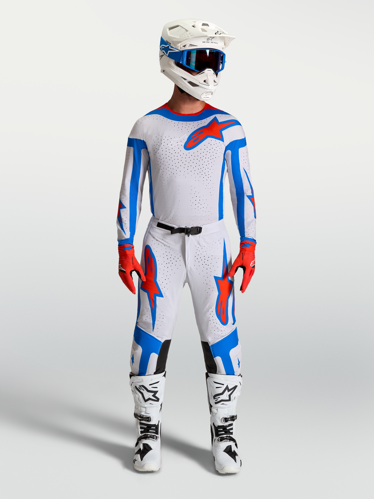 Alpinestars Supertech Vesta, męski zestaw motocrossowy, jasnoliliowy i czerwony, zawiera koszulkę, spodnie i buty wyścigowe.
