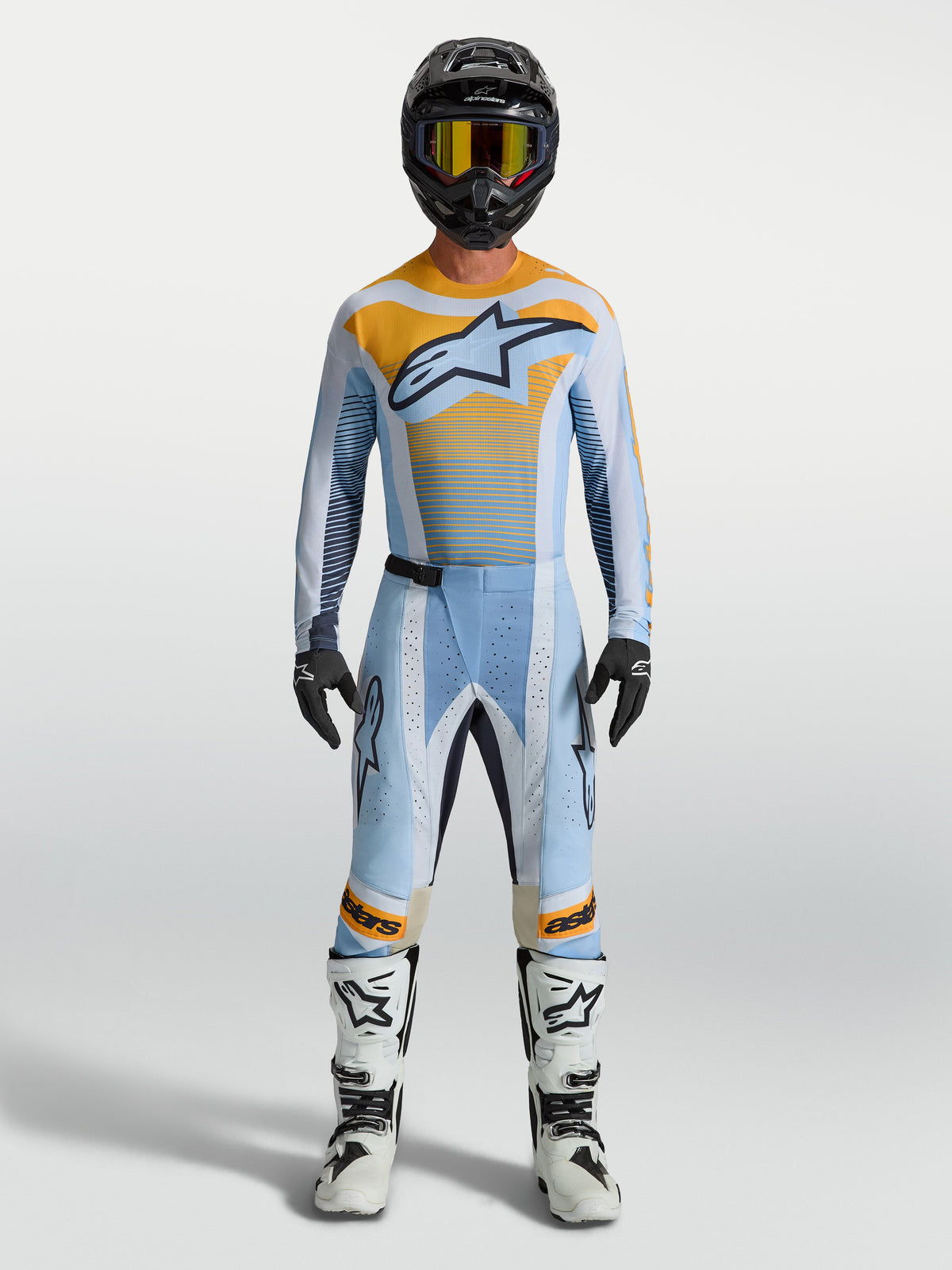 Alpinestars spodnie Techstar Maven, niebieskie i pomarańczowe męskie spodnie motocrossowe race fit z elastycznymi strefami.