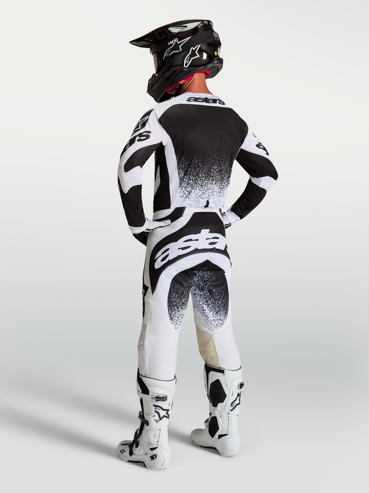 Spodnie Alpinestars Techstar Swan, męska biało-czarna odzież motocrossowa, widok z tyłu, sportowy, elastyczny krój.
