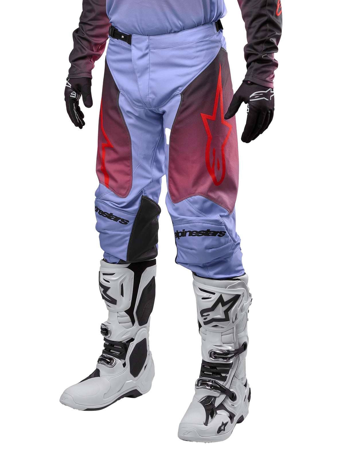 Alpinestars 2024 Racer Hoen Pants, Motocross Pants, Lavan Purple and Black with red graphics, featuring red star logos on the thighs and black lettering on the knees, worn with white and black boots and black gloves