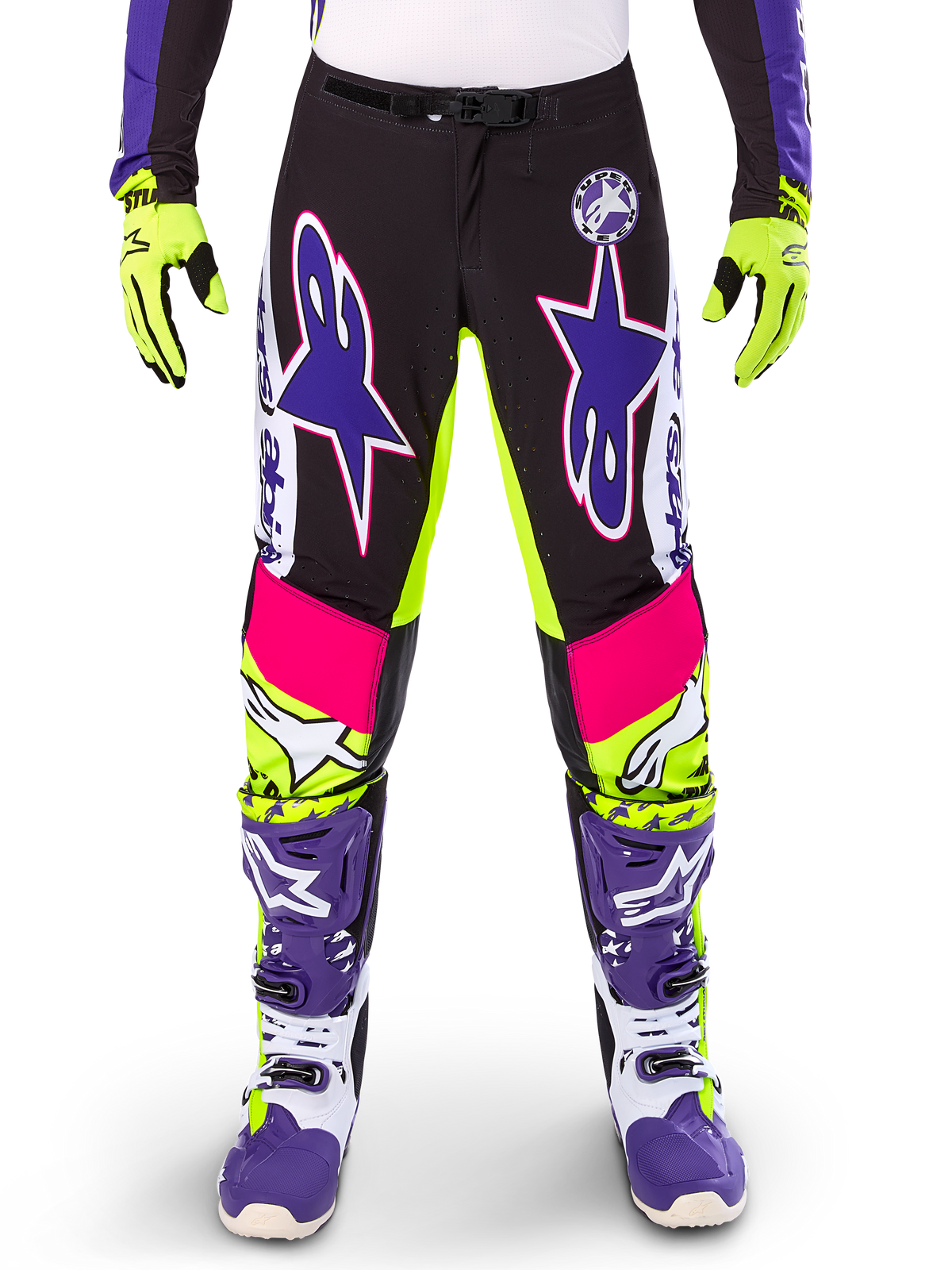 Alpinestars Limited Edition Supertech Dirt Studios Pants, Motocross Pants, White Purple and Yellow Fluo, featuring black panels with neon yellow and pink accents, large purple star logos, shown with matching neon yellow gloves and purple racing boots, durable off-road racing apparel