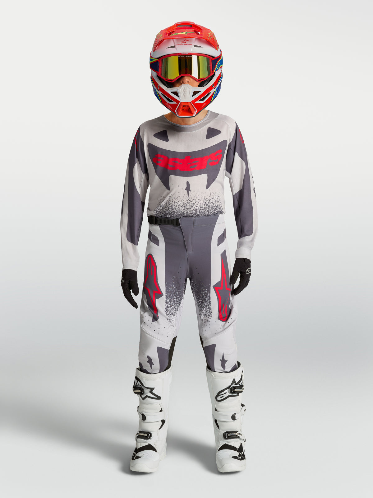 Alpinestars Spodnie Supertech Swan młodzieżowe, szare i czerwone fluo spodnie motocrossowe, sportowy krój.