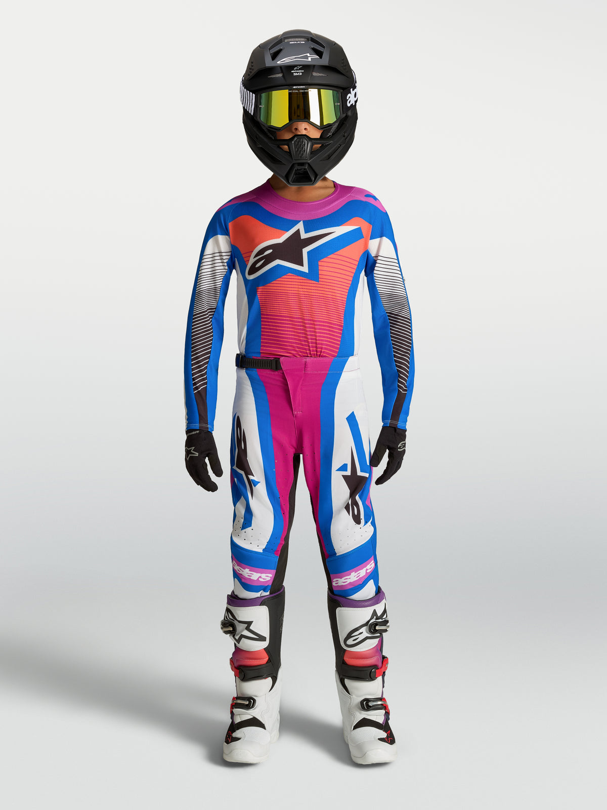 Alpinestars spodnie Supertech Maven młodzieżowe 2027, białe, koralowe i niebieskie, styl motocrossowy off-road.