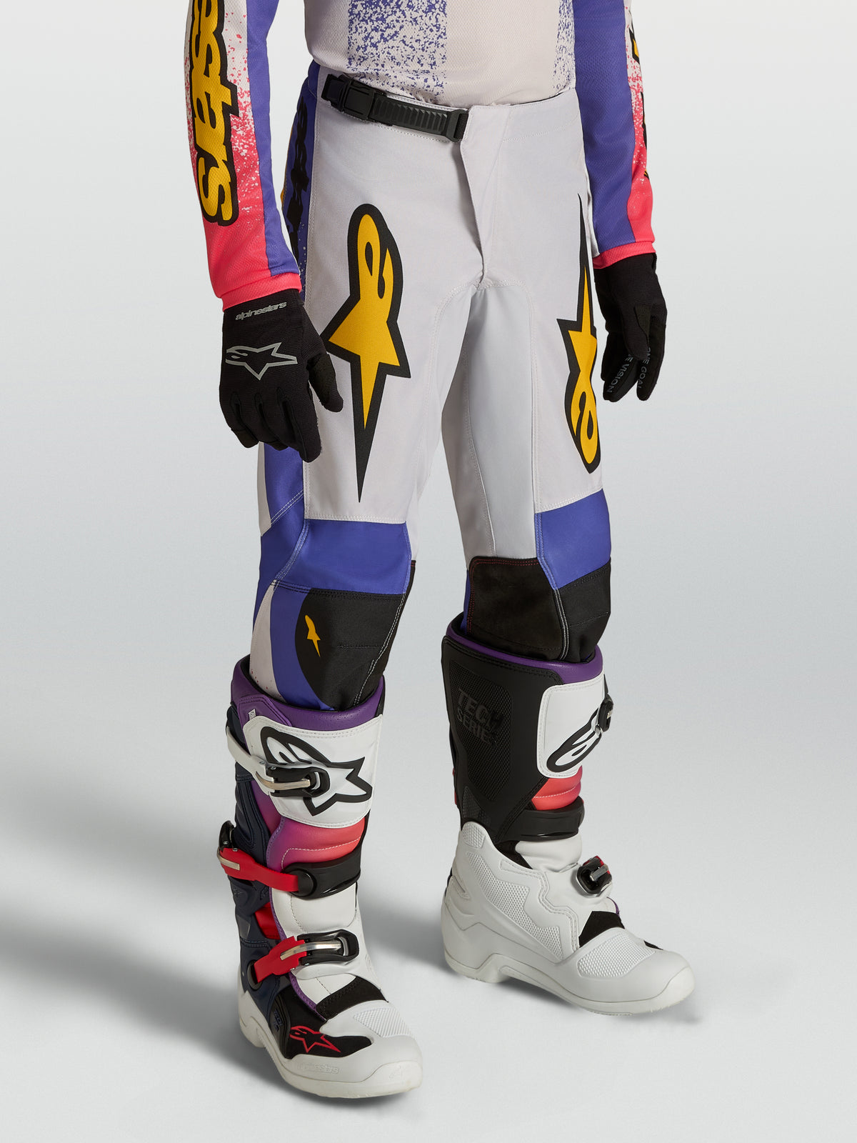 Alpinestars spodnie Fluid Drag młodzieżowe, niebieskie i fioletowe spodnie motocrossowe, złote grafiki, ergonomiczny krój