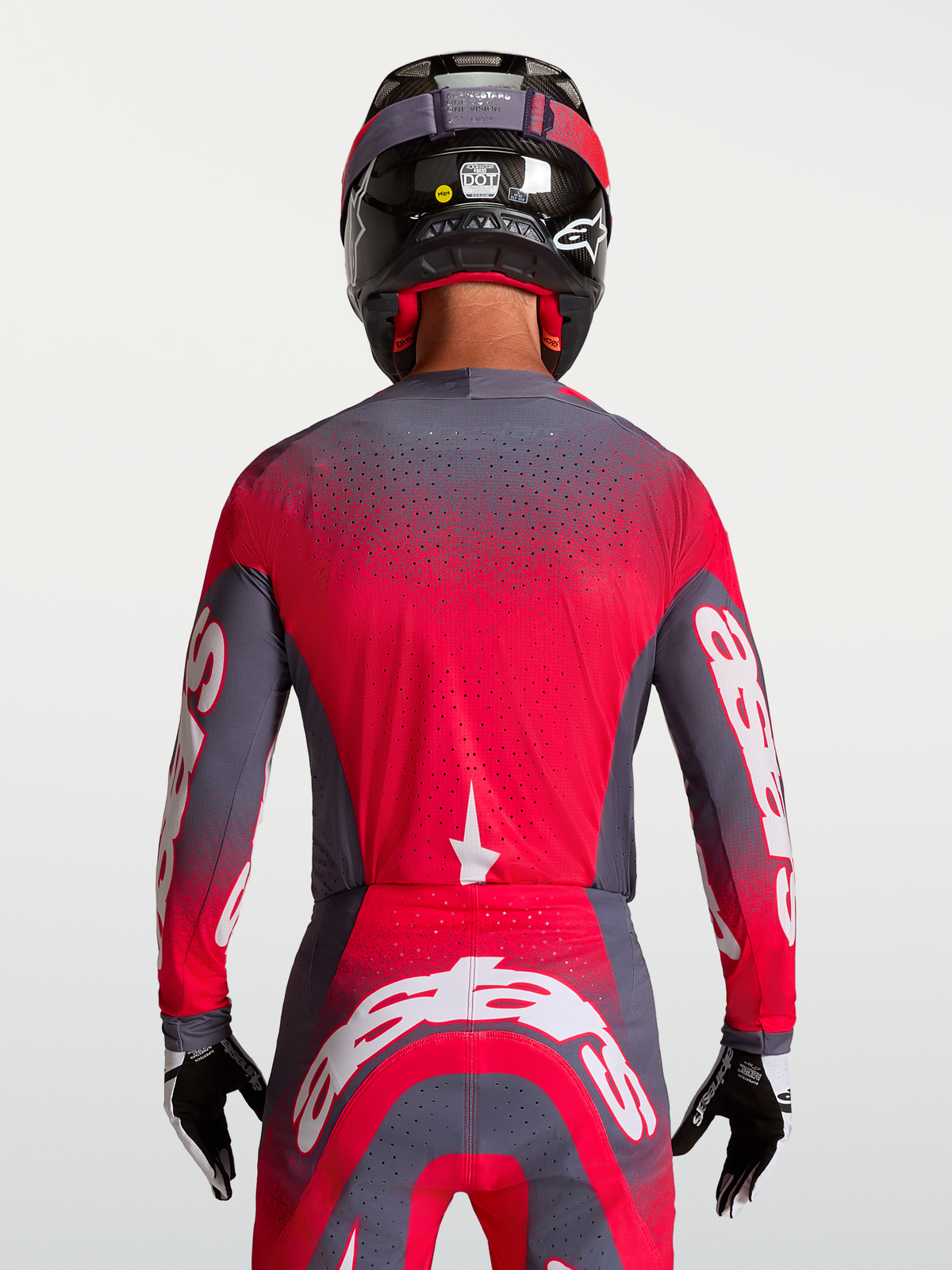 Alpinestars Koszulka Supertech Hiten AFD, szara i czerwona fluo, laserowe perforacje, widok od tyłu, model motocrossowy.