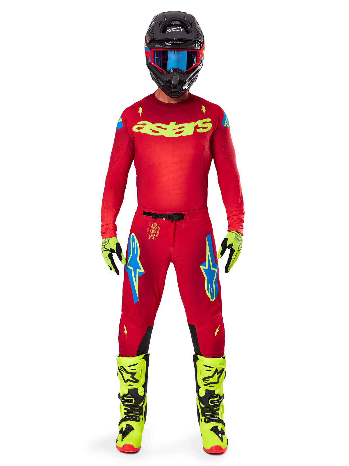 Motocross rider wearing complete Alpinestars 2025 Supertech Maker Gear Set, Bright Red jersey with yellow fluo 'astars' branding, matching red pants with blue accents, black helmet with blue goggles, bright yellow fluo boots and gloves, coordinated outfit for off-road racing