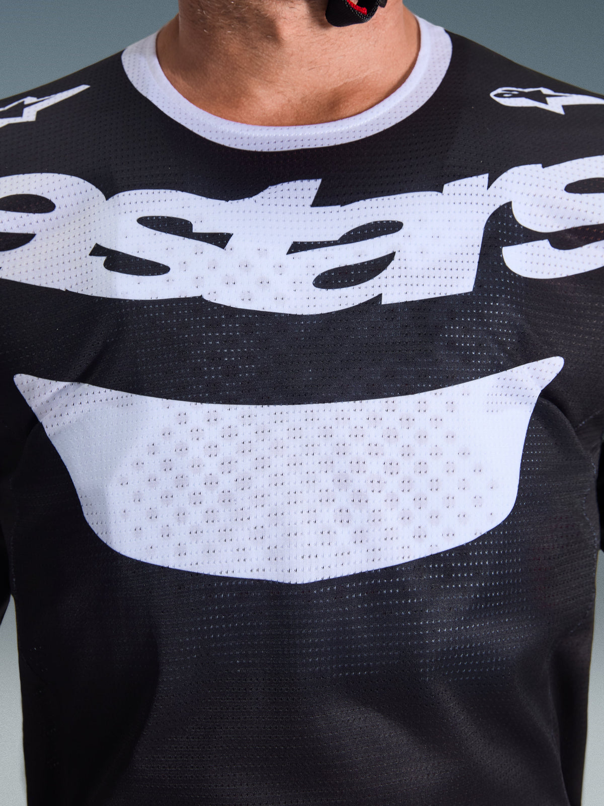 Alpinestars 2026 Racer Air Riway Jersey, Motocross Jersey, Black and White, close-up of chest showing large white graphic and breathable mesh construction, white collar and shoulder logos