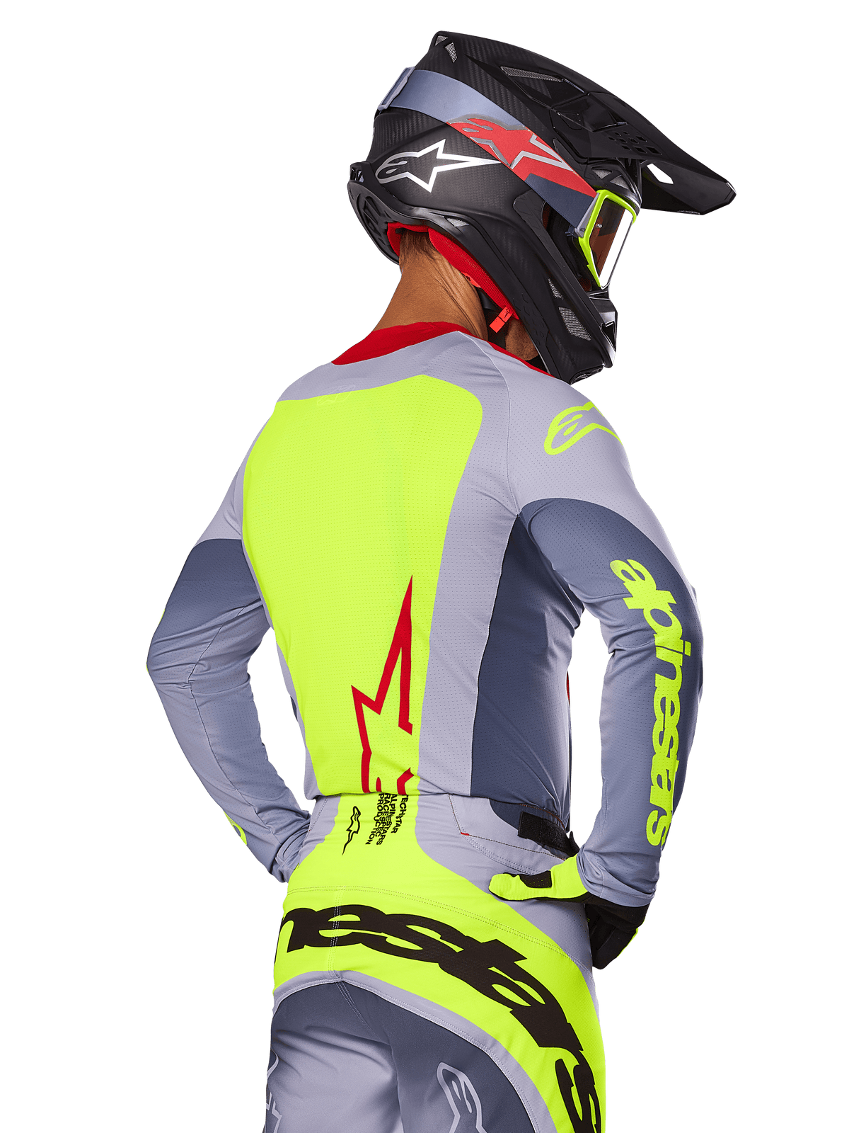 Alpinestars 2025 Techstar Melt Jersey, Bright Red Gray, back view of motocross rider wearing gray and neon yellow racing gear, red star logo on back, matching black and red helmet, performance off-road apparel