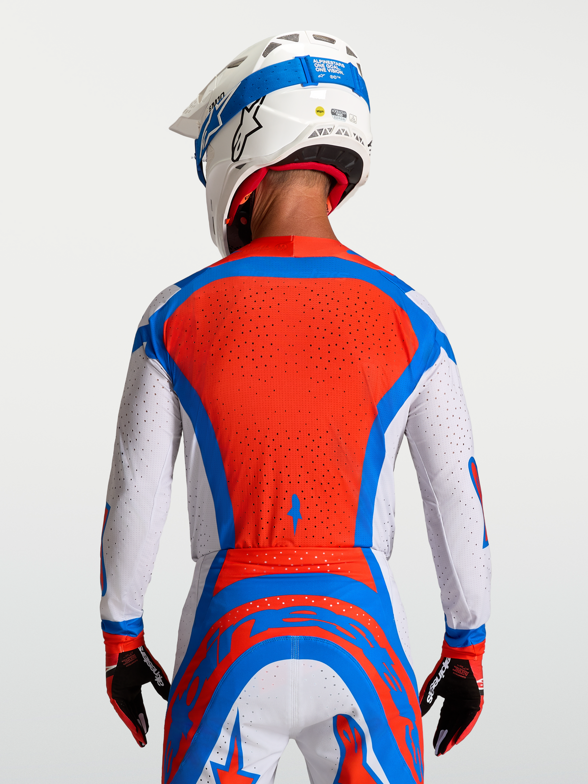 Alpinestars Koszulka Supertech Vesta, męska koszulka MX, czerwona, biała i niebieska, wentylowany panel z siatki na plecach.