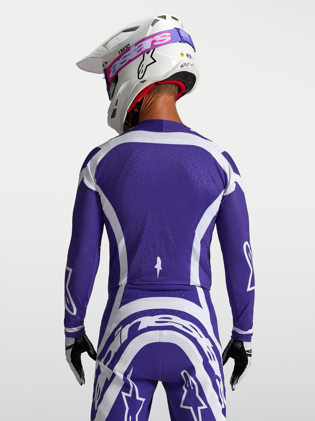 Alpinestars koszulka Supertech Vesta, ciemnoniebieska i biała wyścigowa koszulka motocrossowa z siatki, widok z tyłu.
