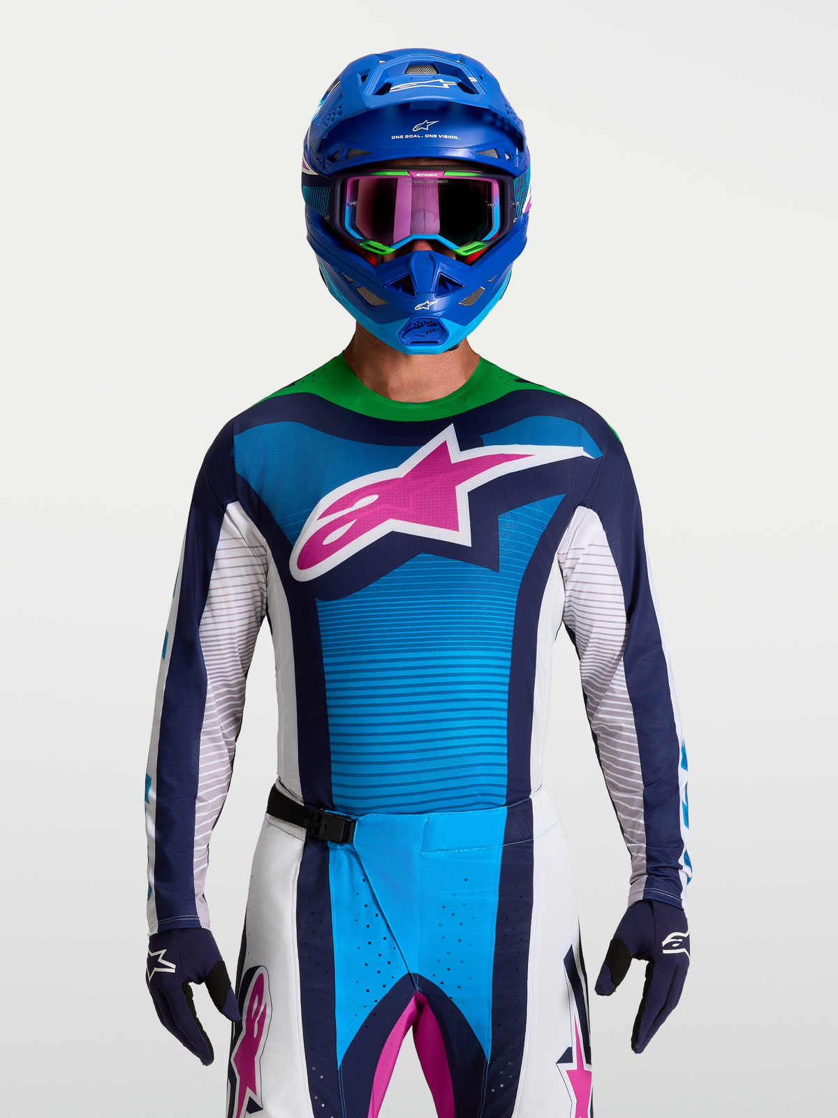Koszulka Alpinestars Techstar Maven, niebiesko-zielona koszulka motocrossowa z różowym logo z gwiazdą, sportowy krój wyścigowy.