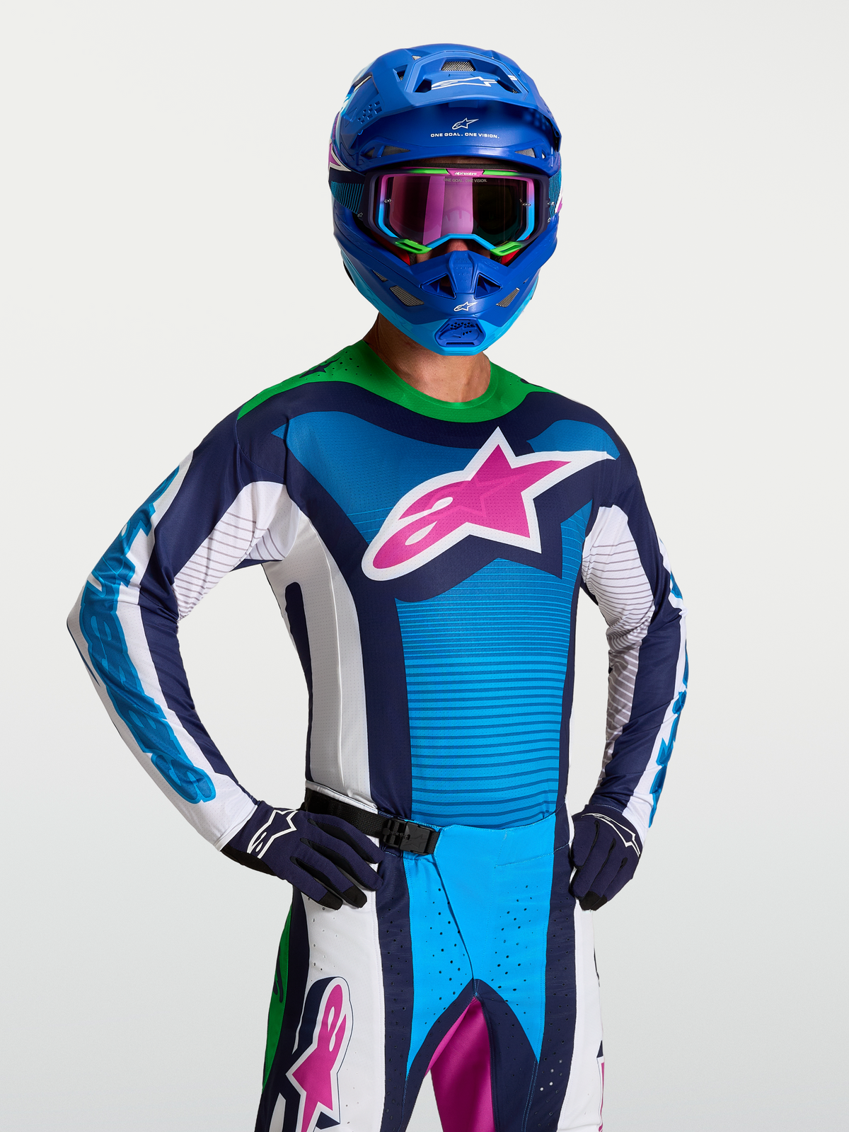 Alpinestars koszulka Techstar Maven, męska niebiesko-biała koszulka motocrossowa z różowym logo i zielonym kołnierzem fluo.